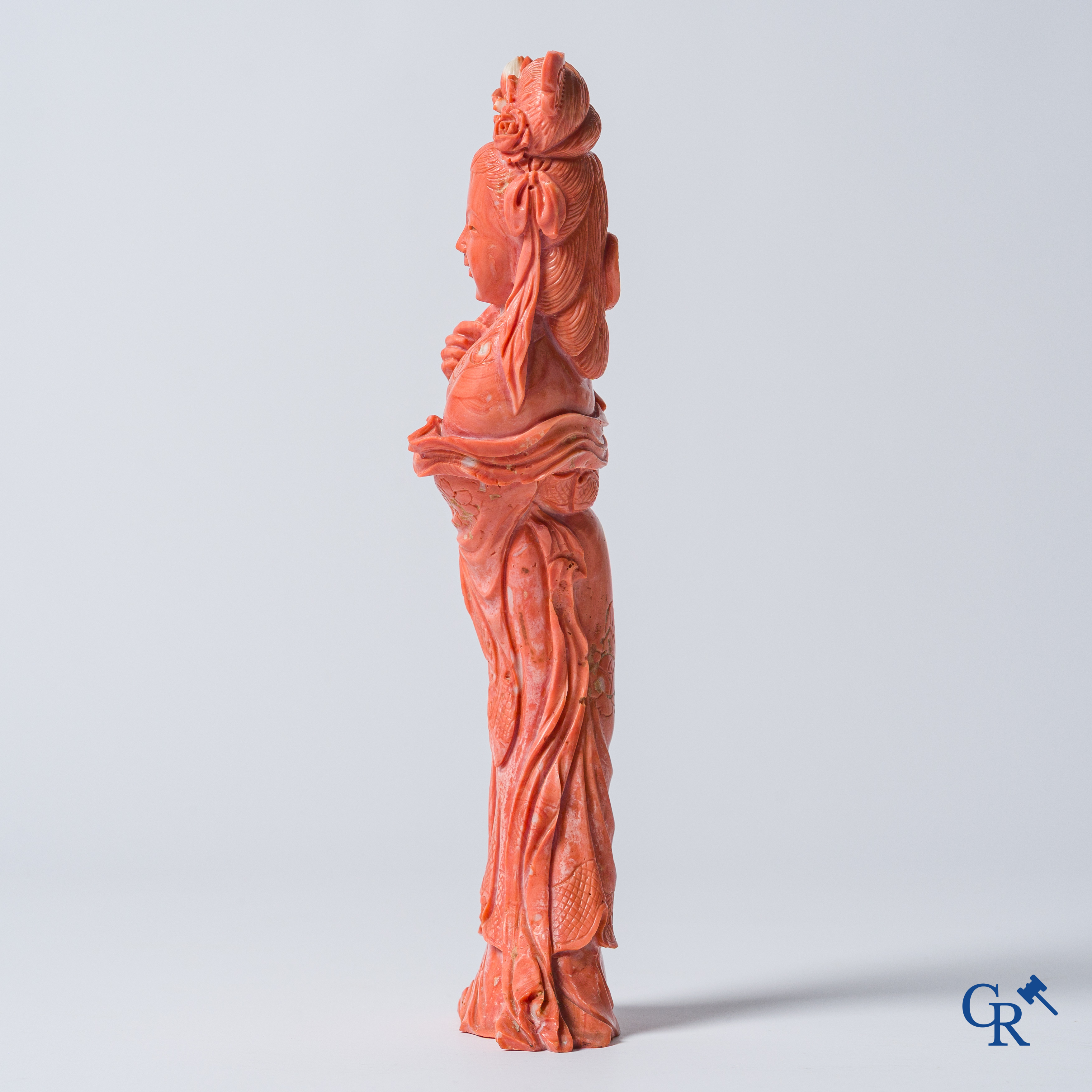 Asian Art, China. A red coral figure of a Chinese lady on a wooden pedestal.