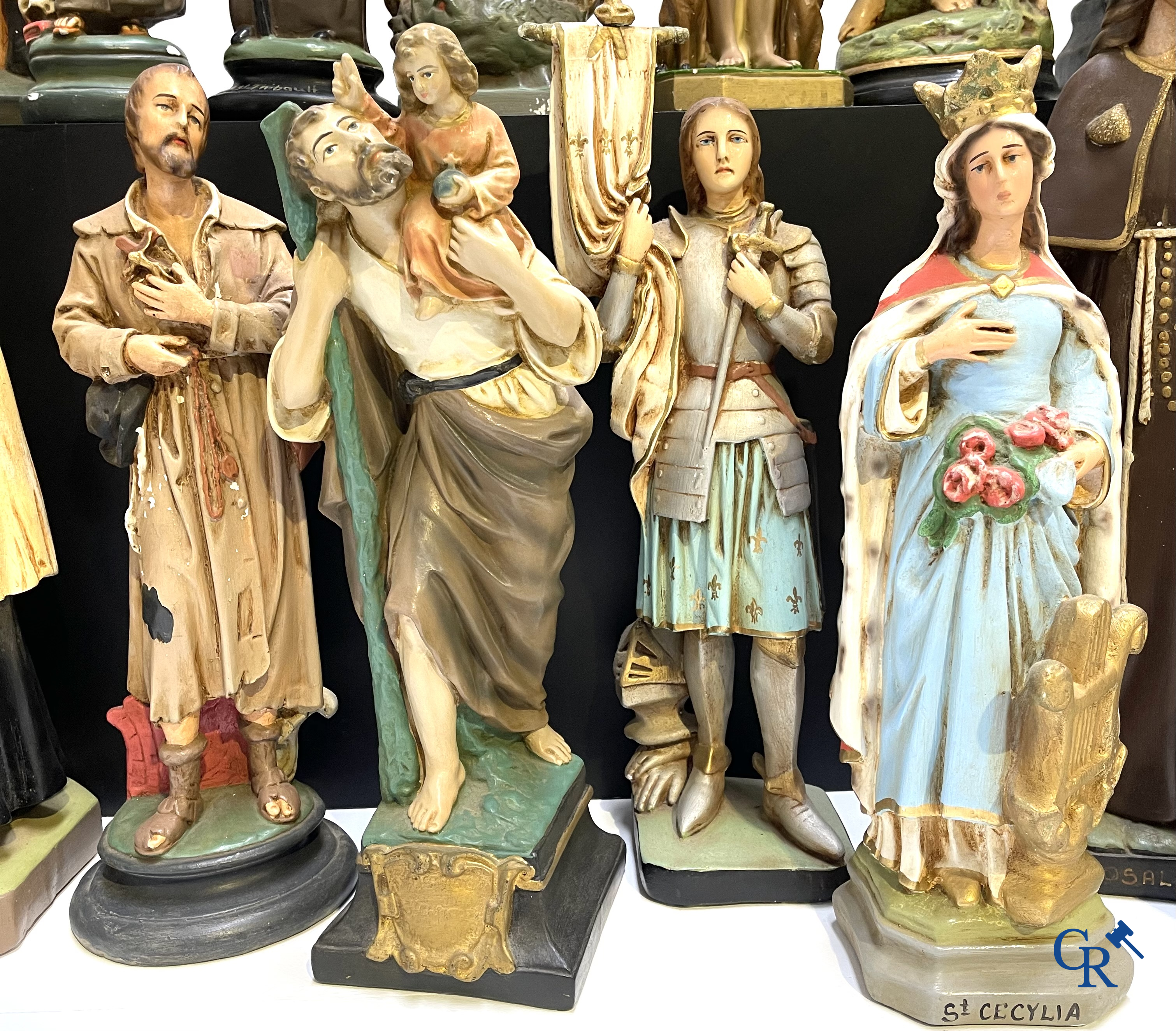 Religious objects. Large lot of various statues of saints in plaster.