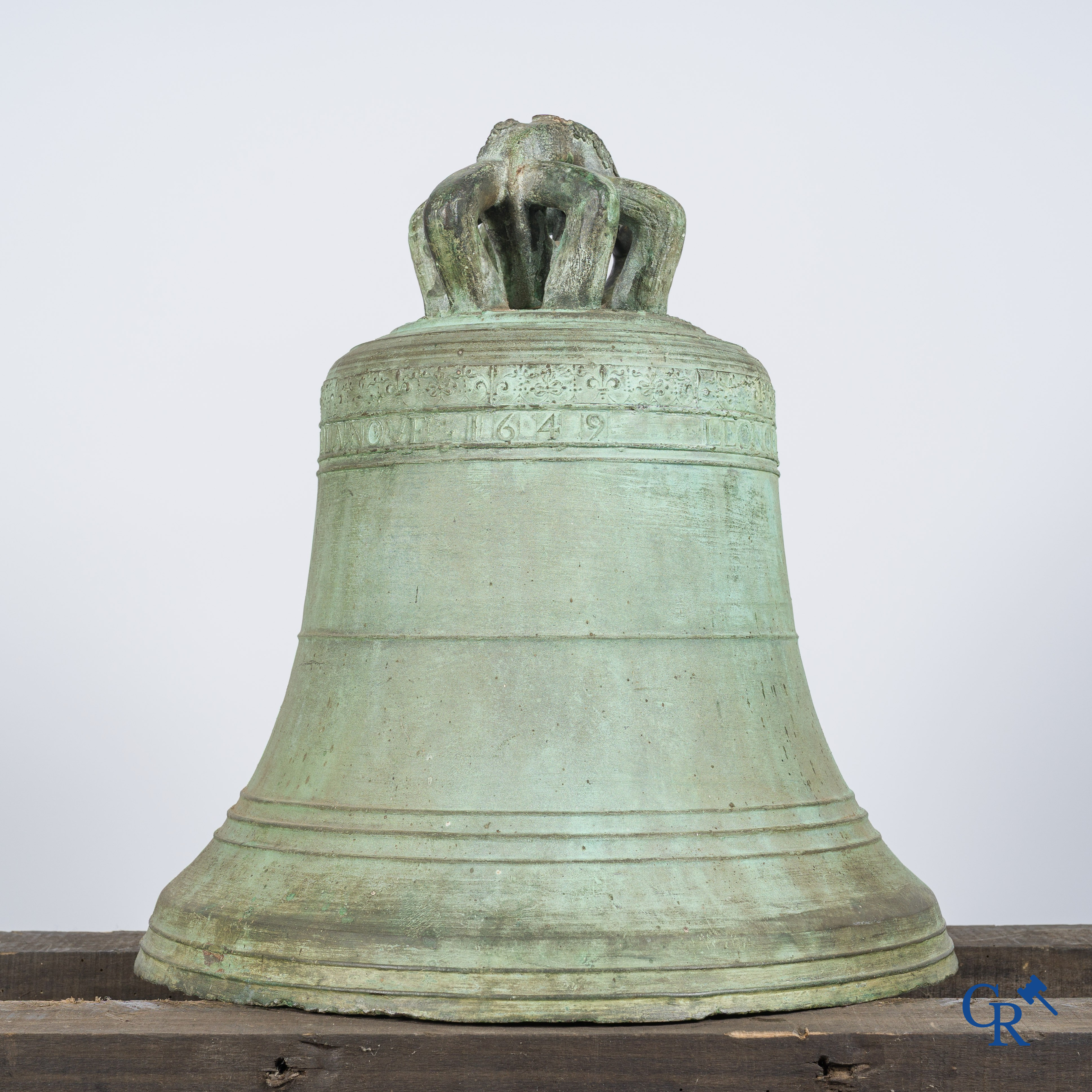 Religious objects. Large antique church crown clock or bell in bronze with inscription band. Dated 1649.