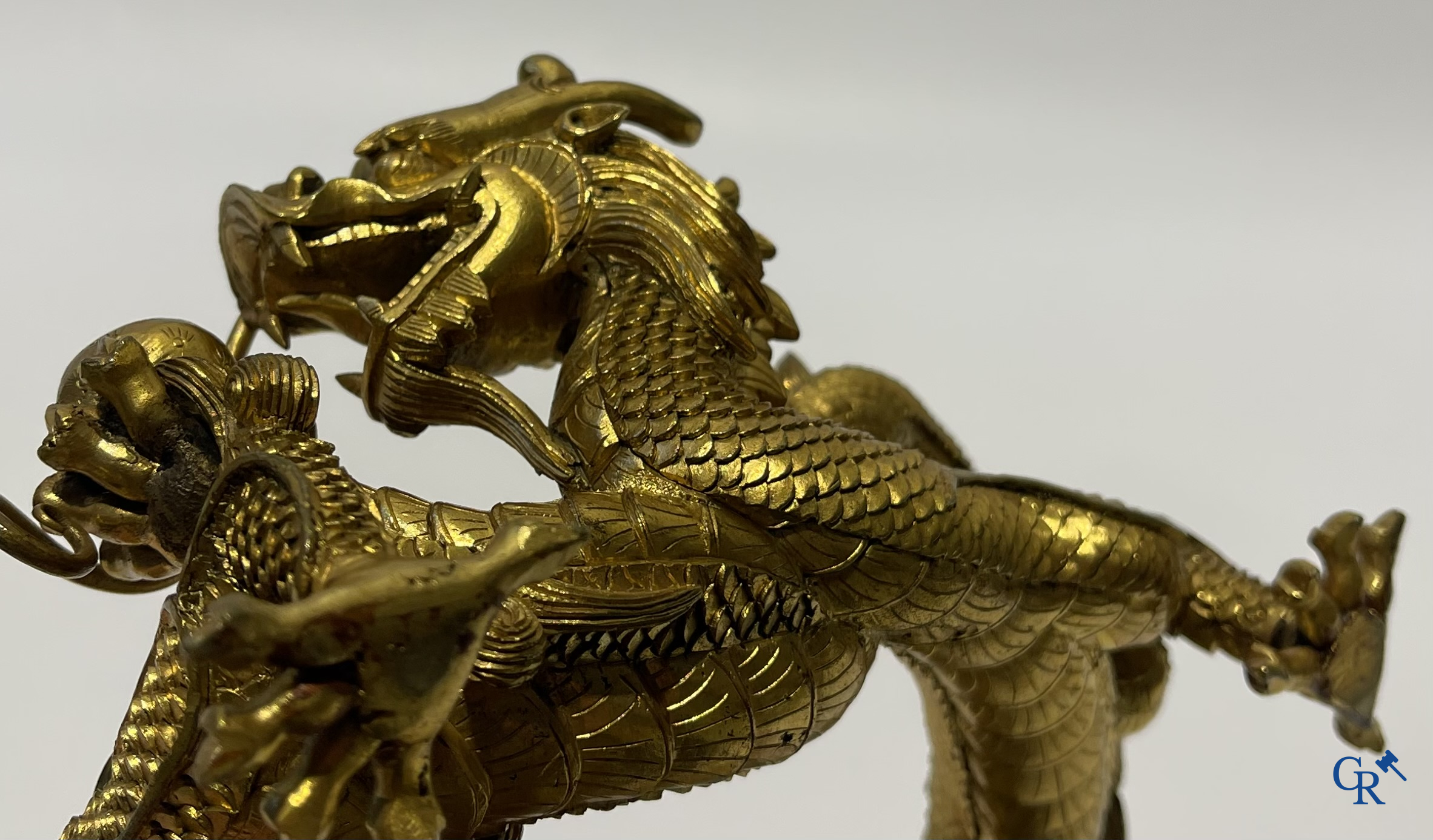 Asian Art. China. A rare Chinese gilt-bronze dragon stand. Qing Dynasty.