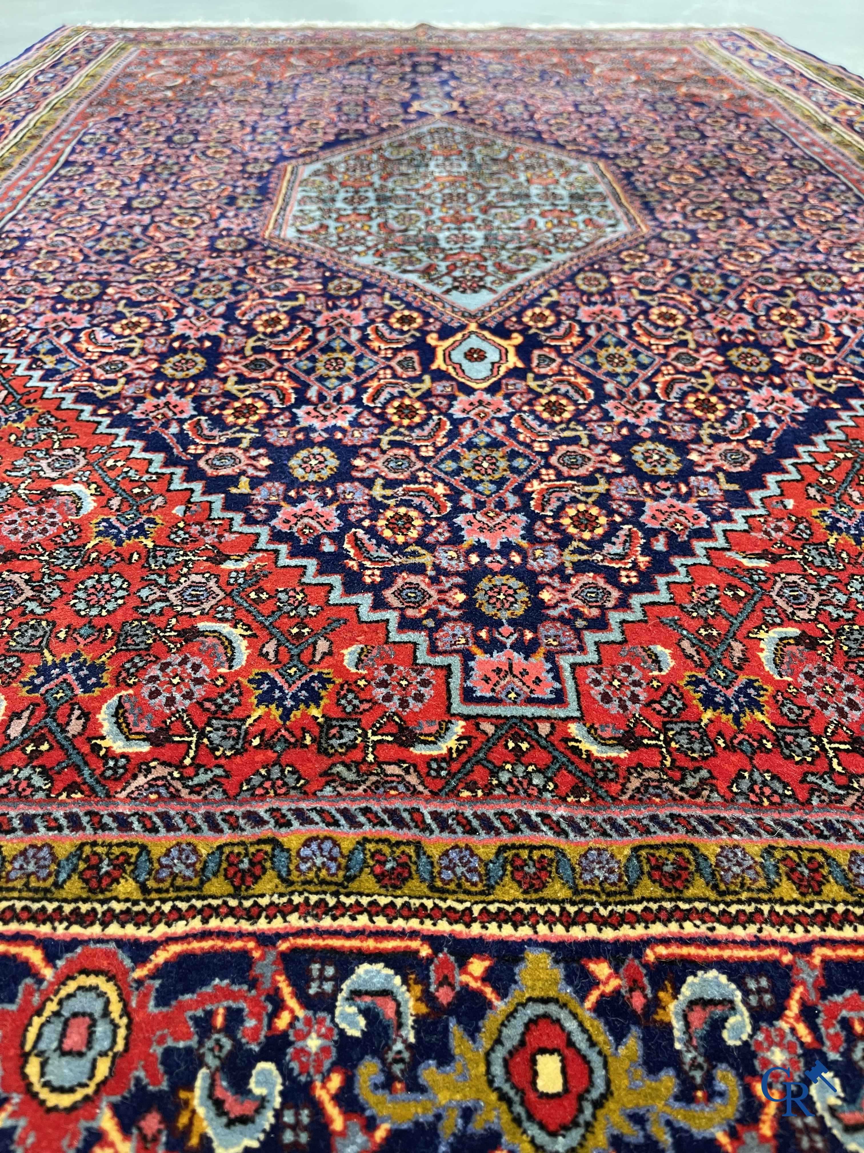 Oriental carpets. 2 hand-knotted rugs in wool.