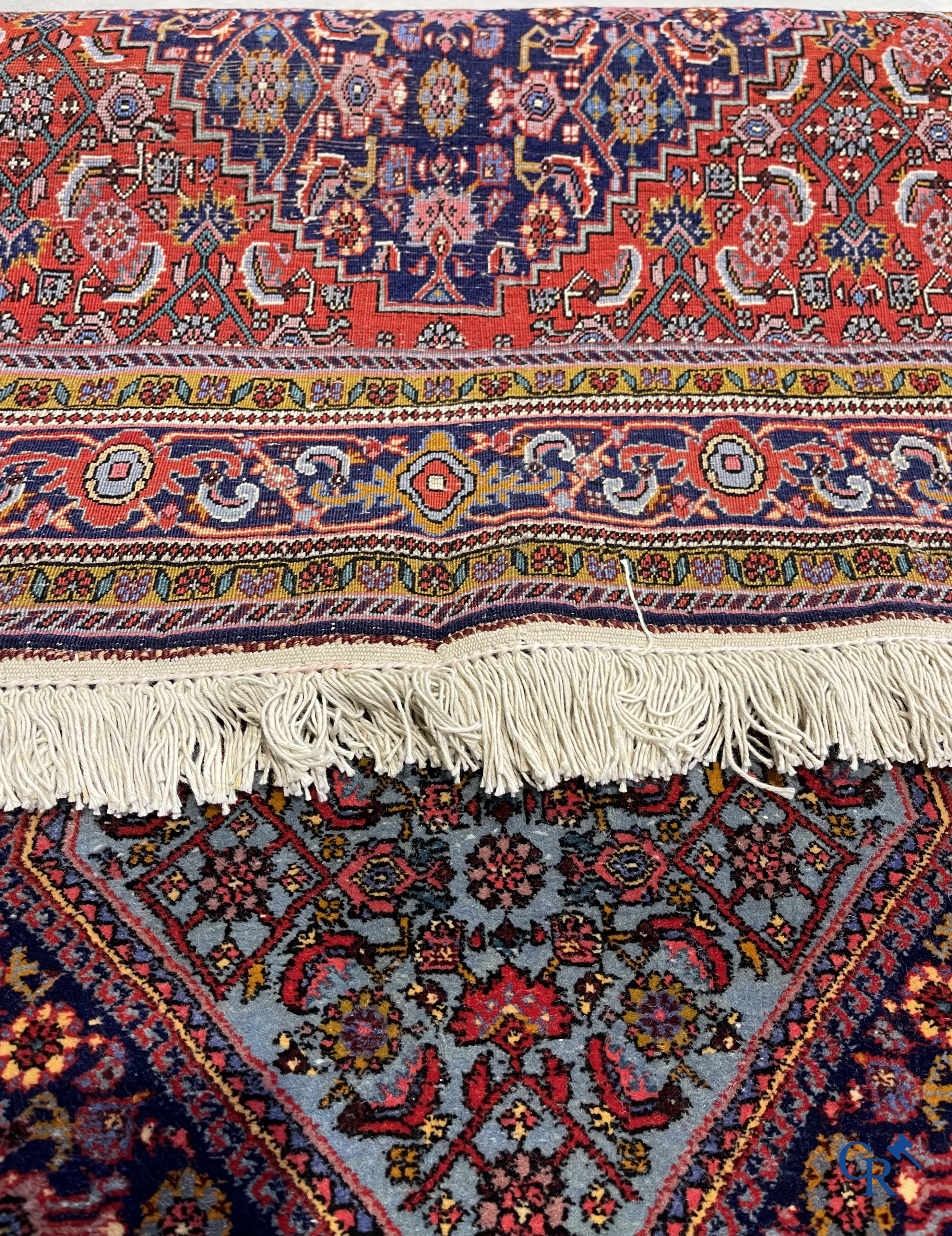 Oriental carpets. 2 hand-knotted rugs in wool.