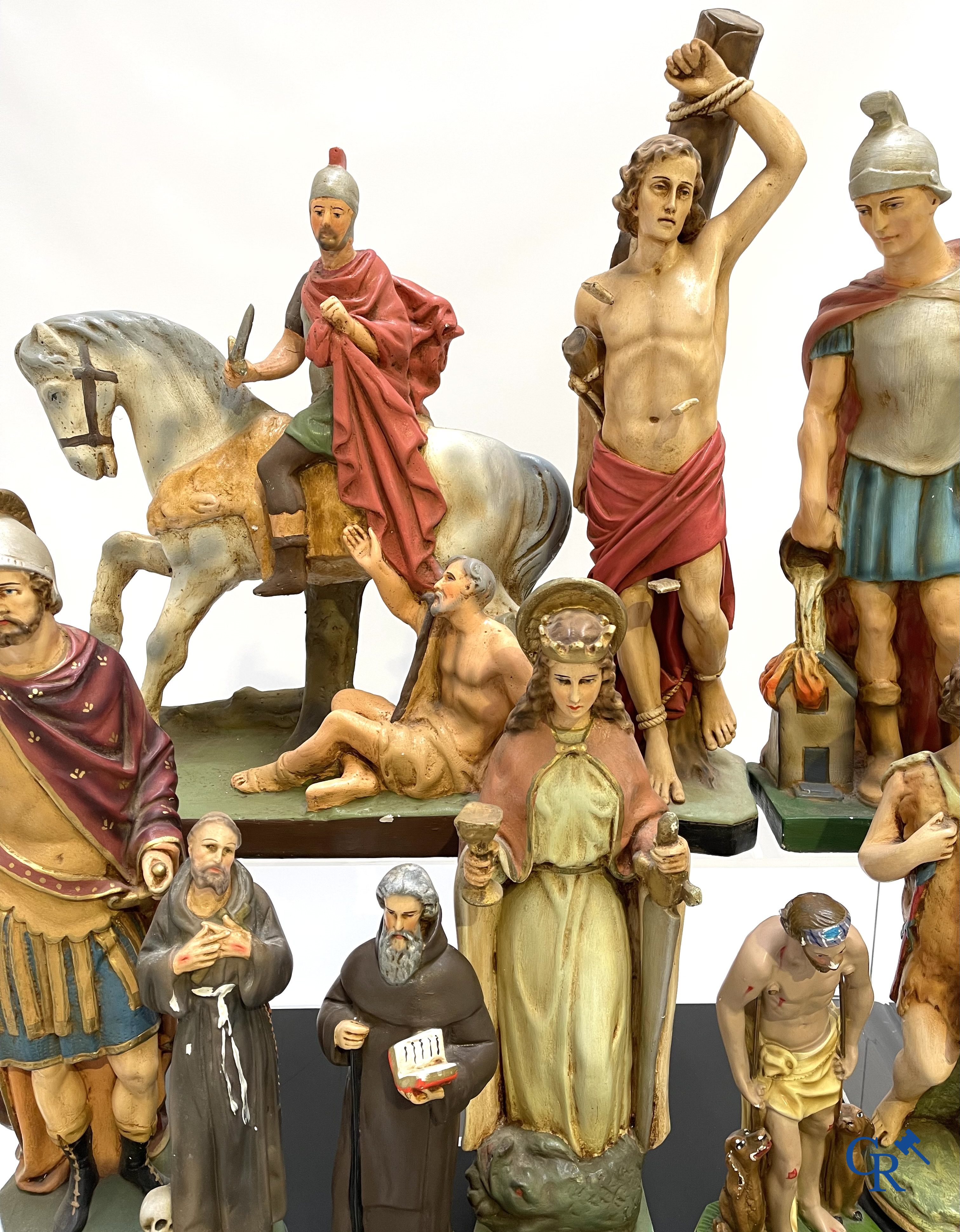 Religious objects. Large lot of various statues of saints in plaster.