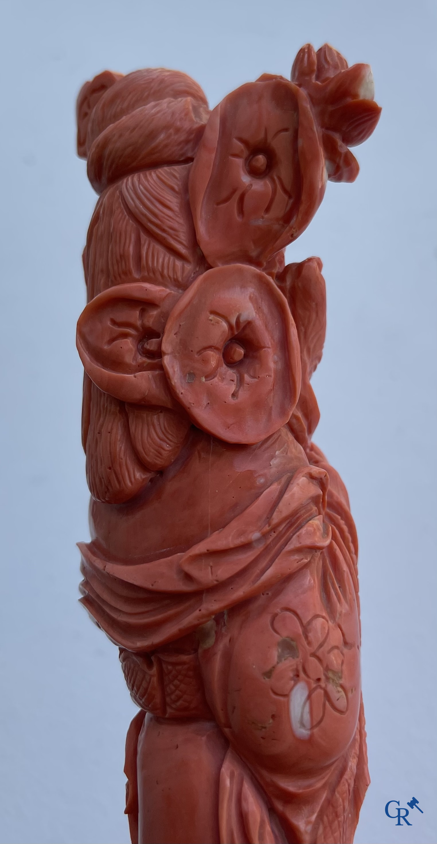 Asian Art, China. A red coral figure of a Chinese lady on a wooden pedestal.
