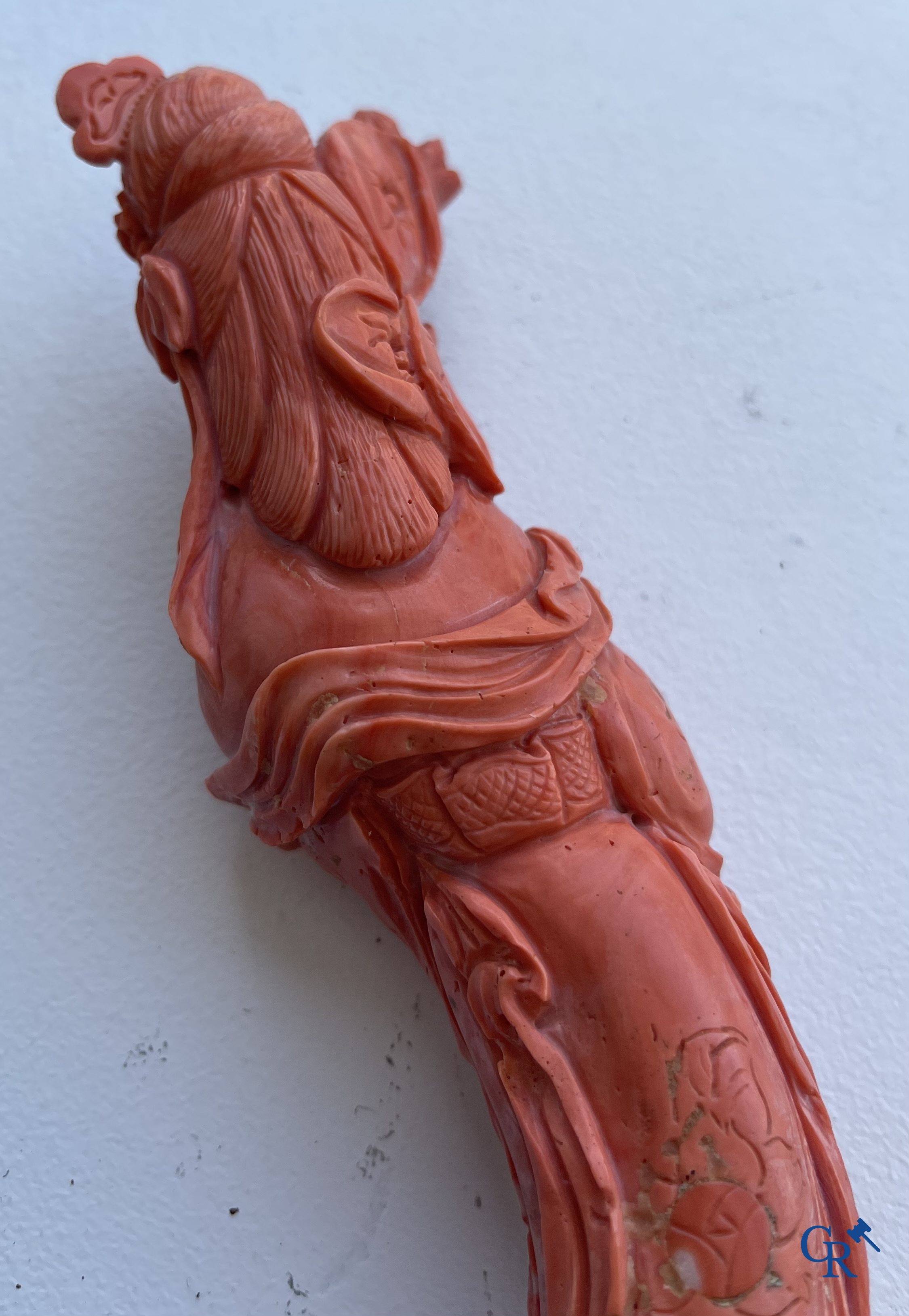 Asian Art, China. A red coral figure of a Chinese lady on a wooden pedestal.