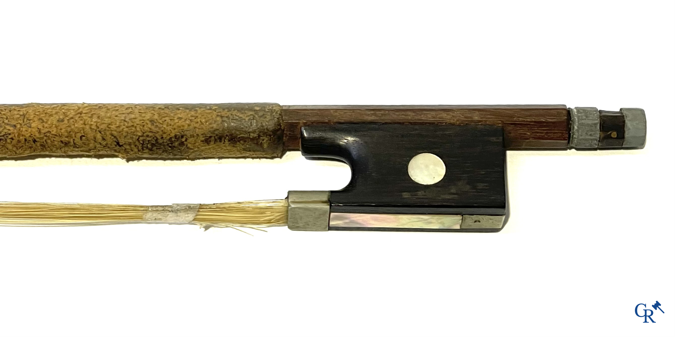 Antique violin with bow in storage case.