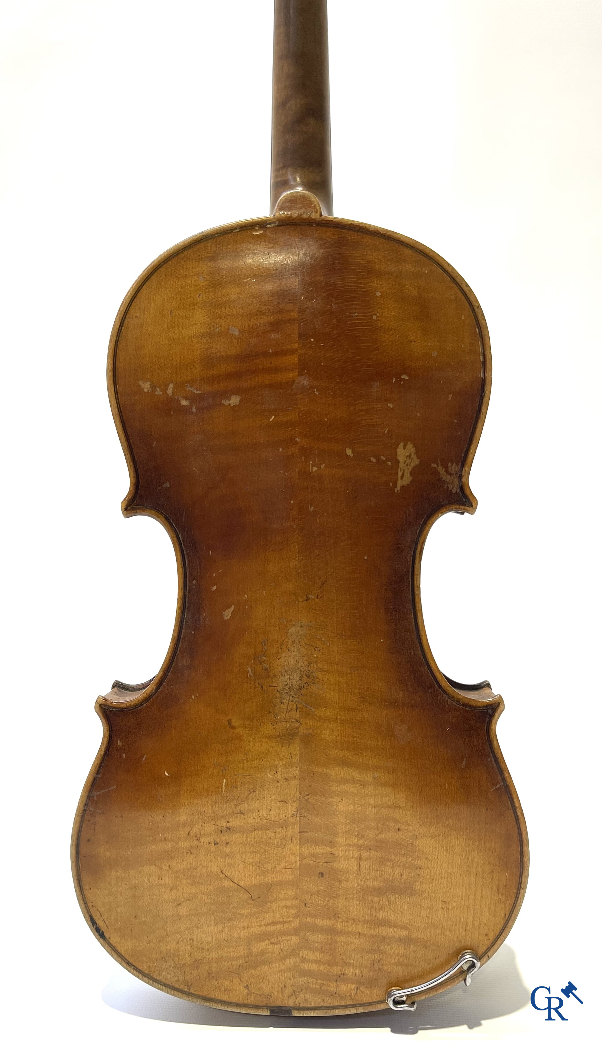 Antique violin with bow in storage case.