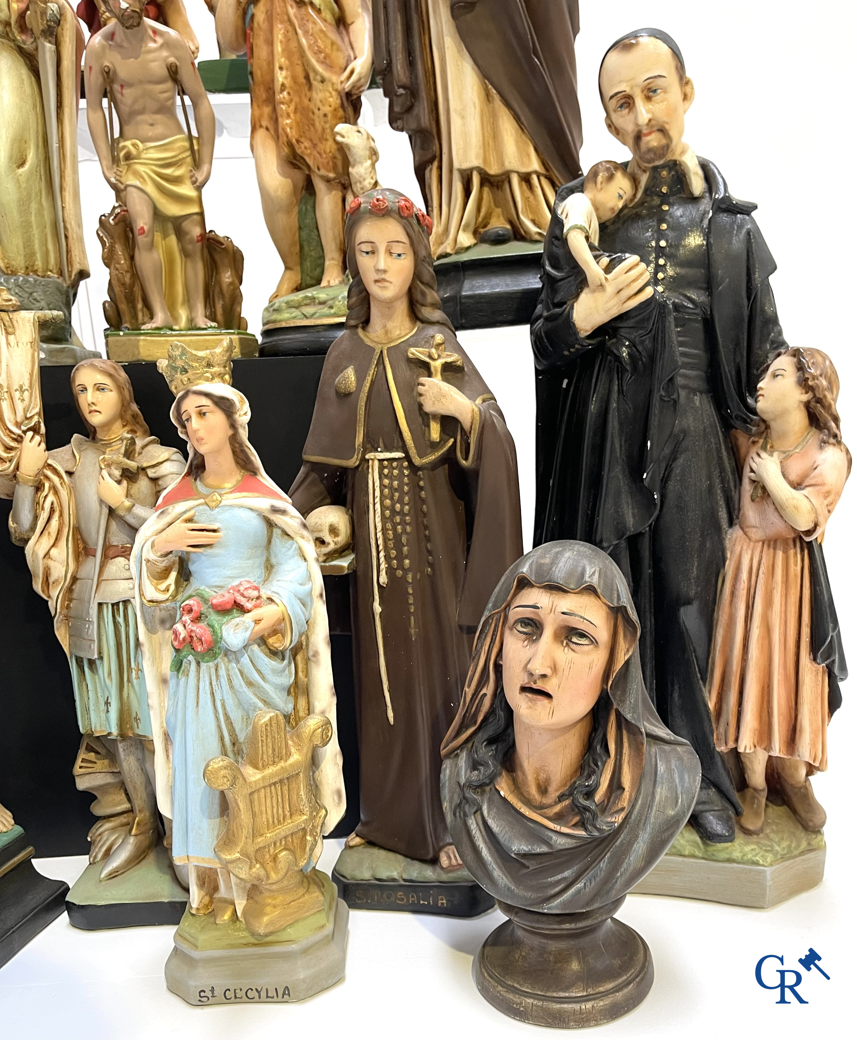 Religious objects. Large lot of various statues of saints in plaster.