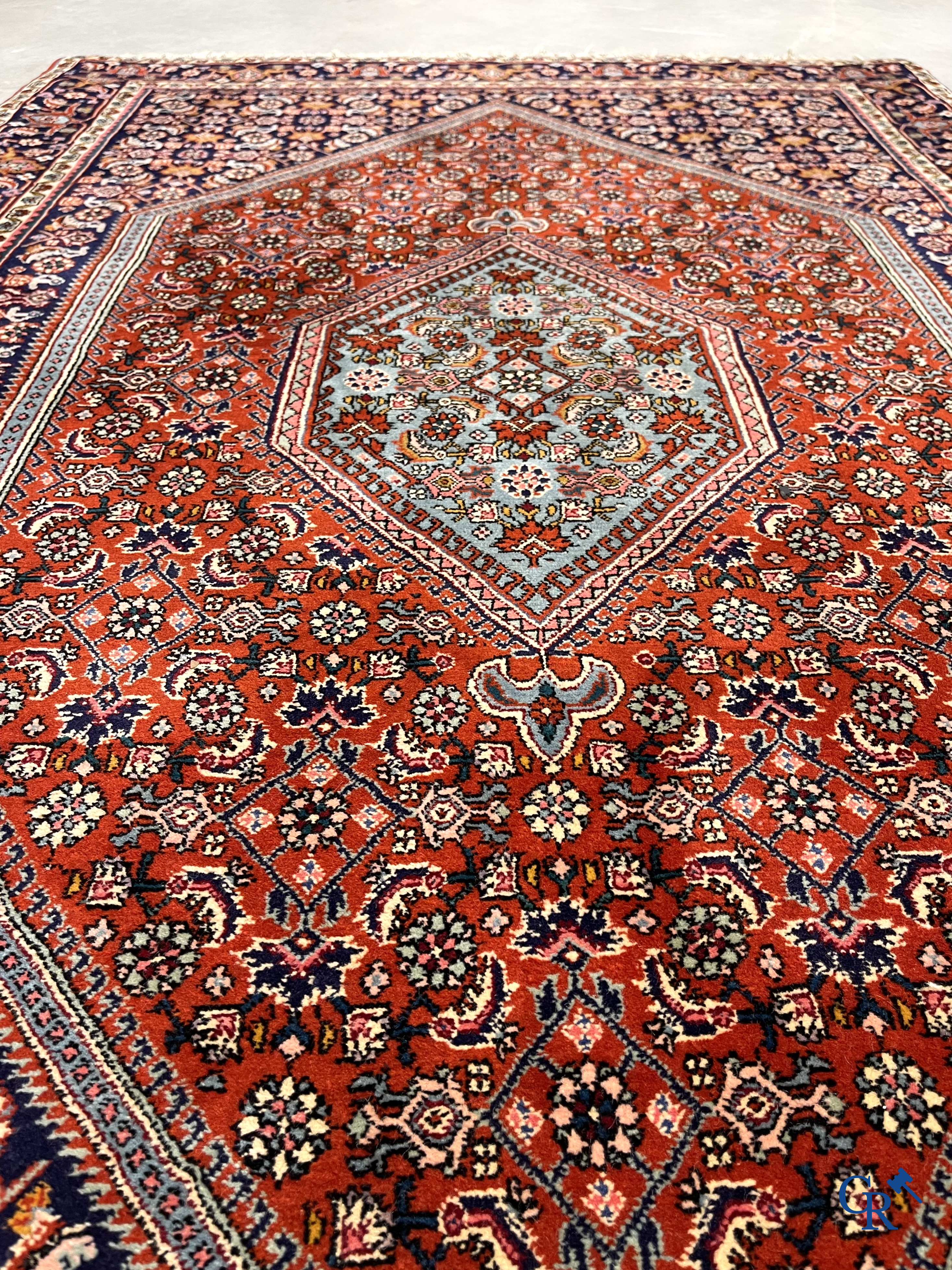 Oriental carpets. 2 hand-knotted rugs in wool.