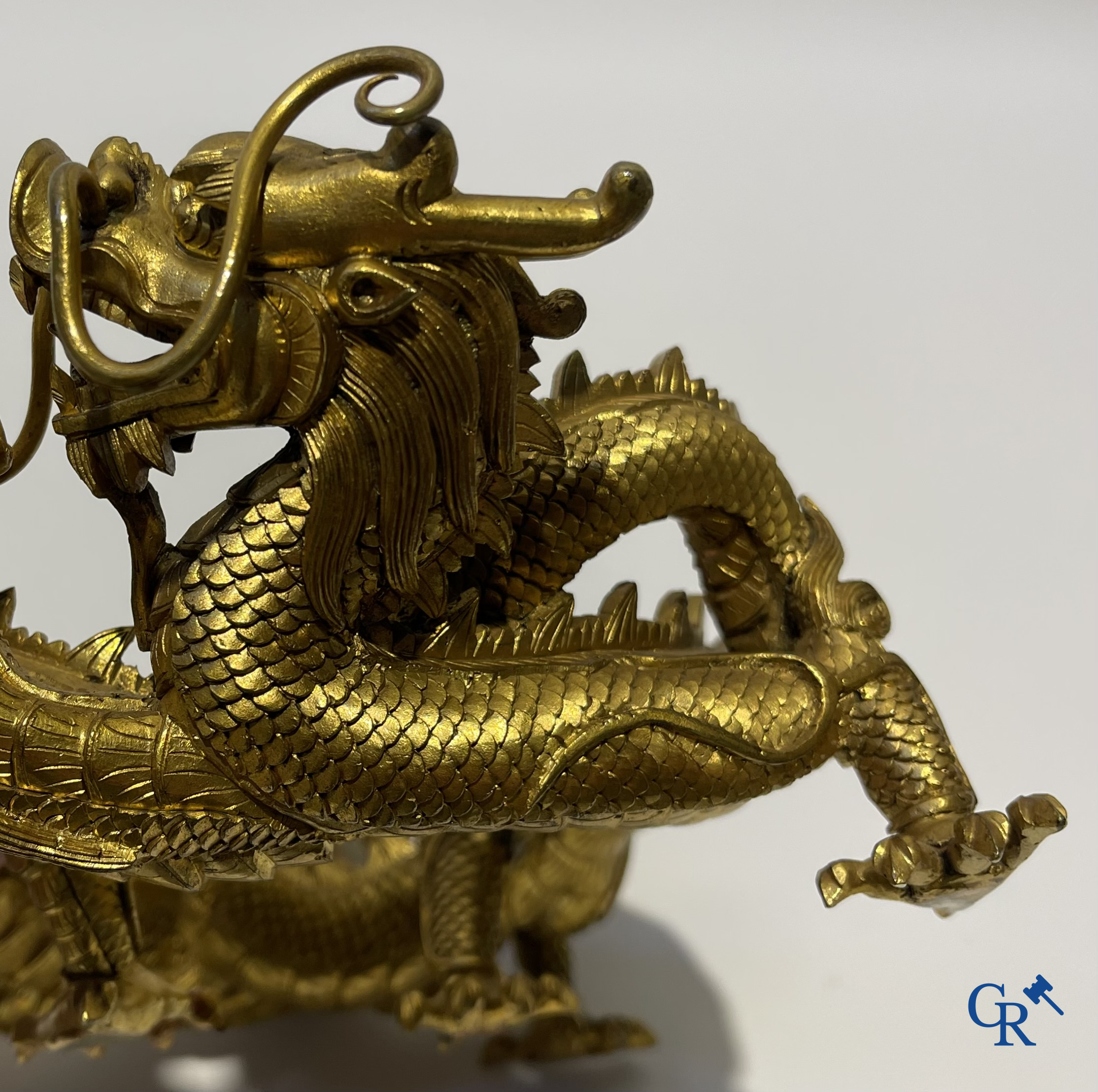Asian Art. China. A rare Chinese gilt-bronze dragon stand. Qing Dynasty.