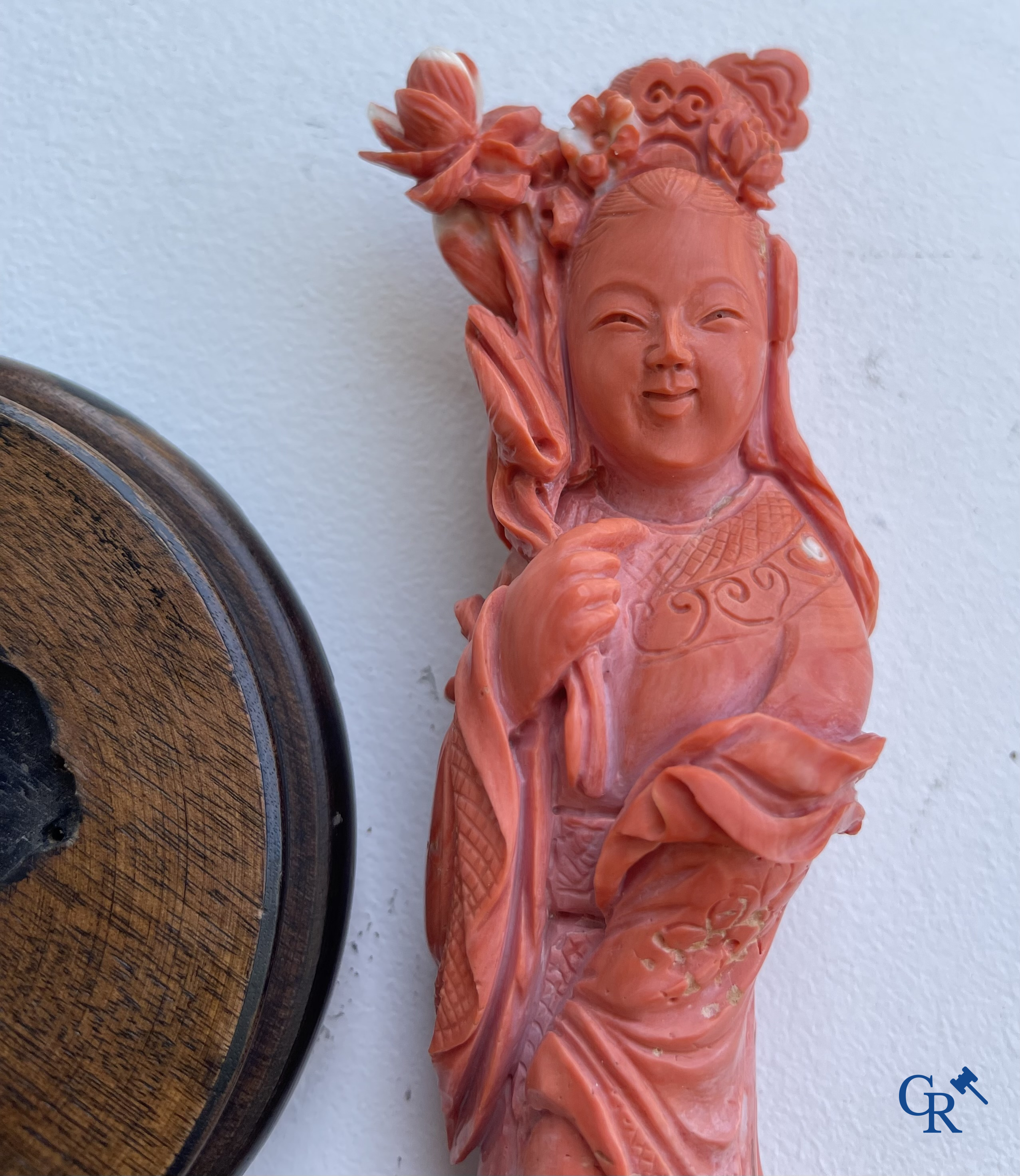 Asian Art, China. A red coral figure of a Chinese lady on a wooden pedestal.