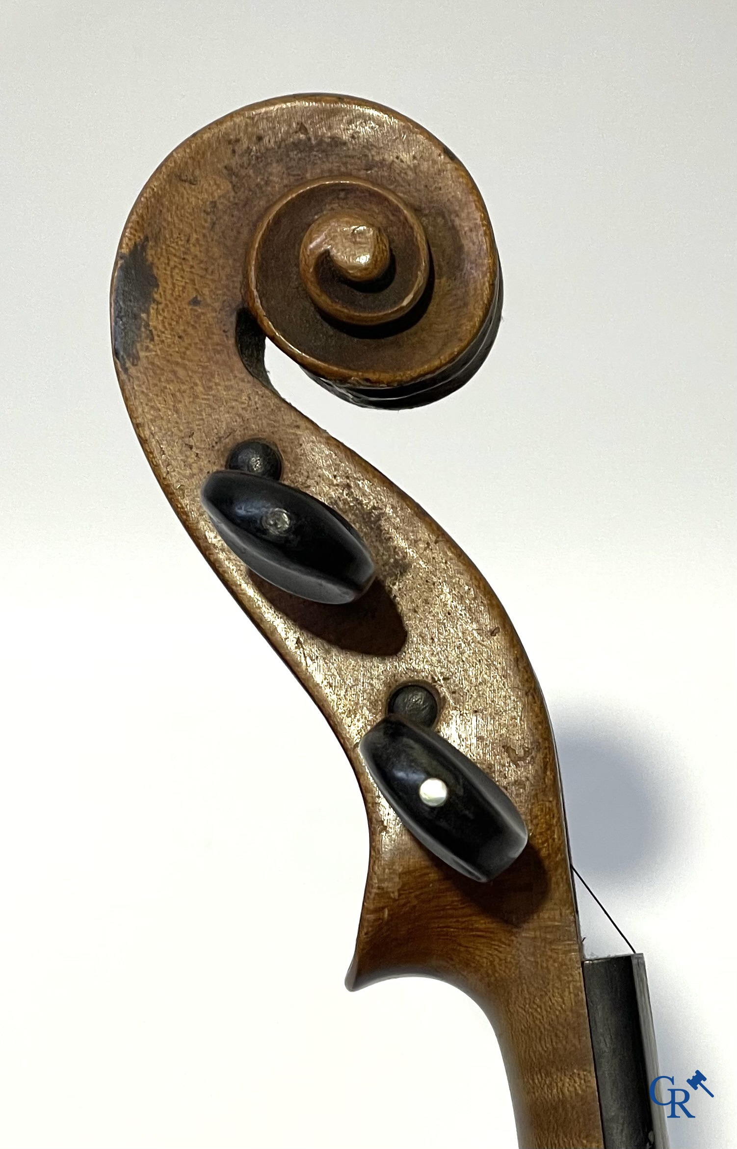 Antique violin with bow in storage case.