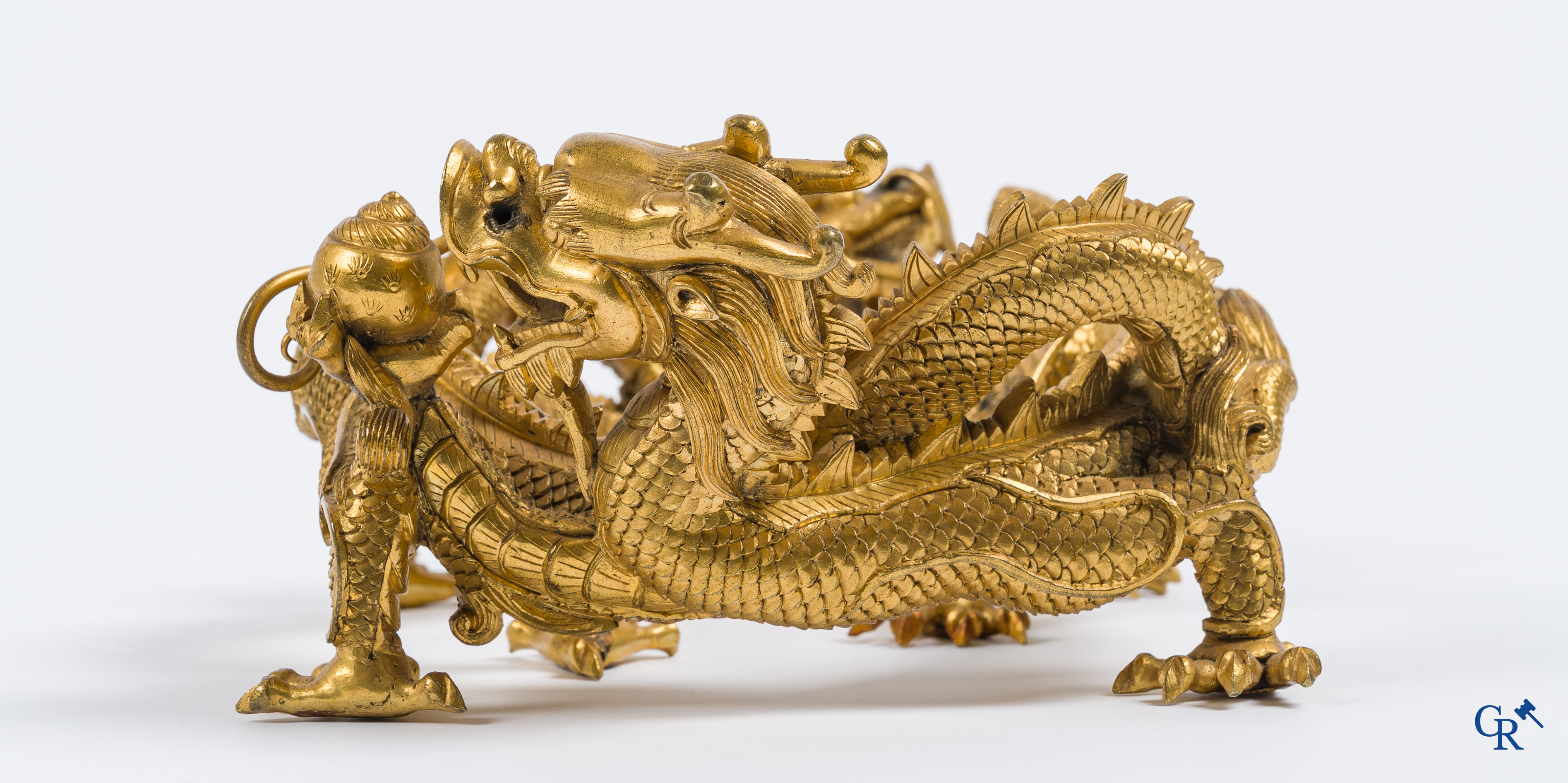Asian Art. China. A rare Chinese gilt-bronze dragon stand. Qing Dynasty.