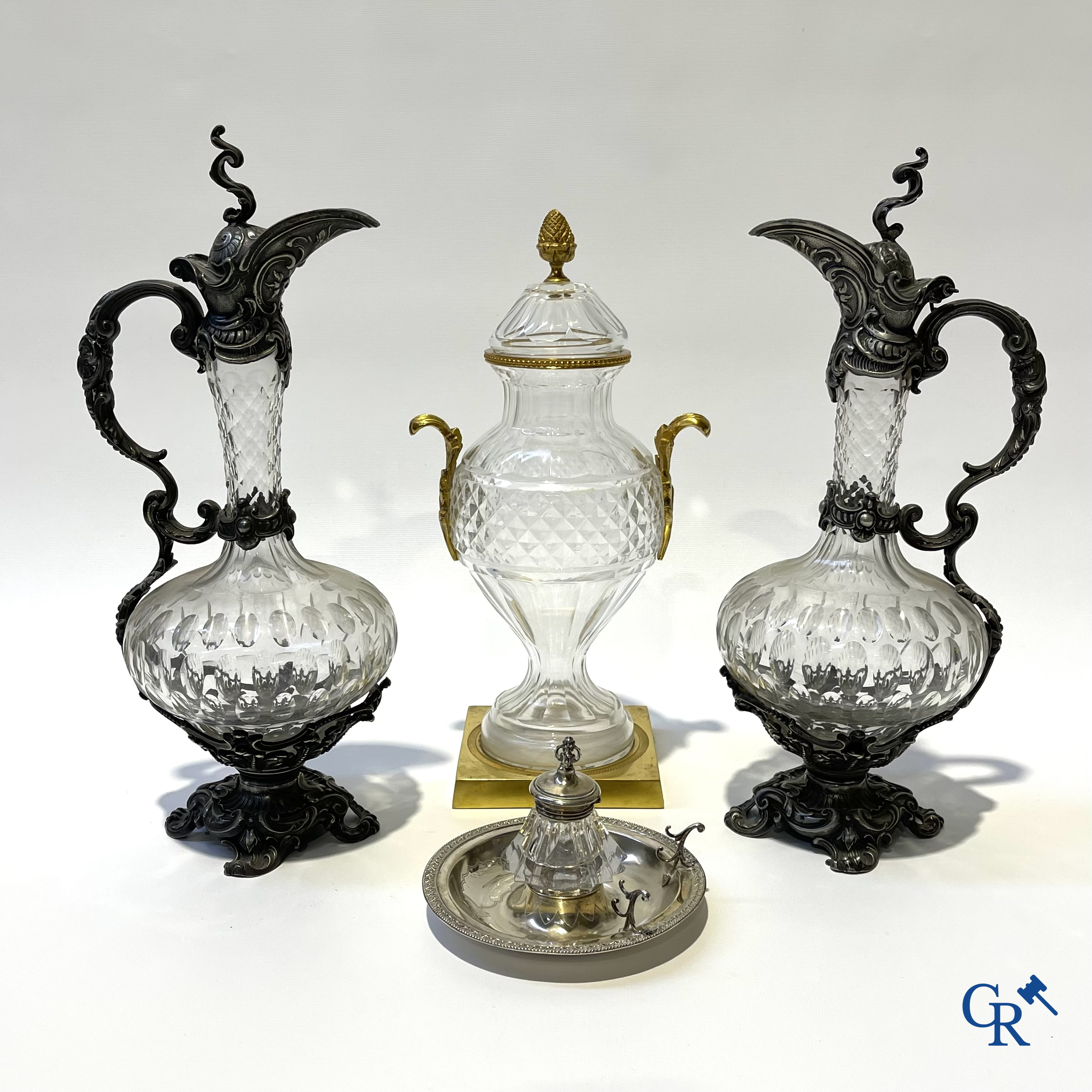 A lot of 2 decanters in crystal, an ink set in silver 800°/00 and a lid vase.