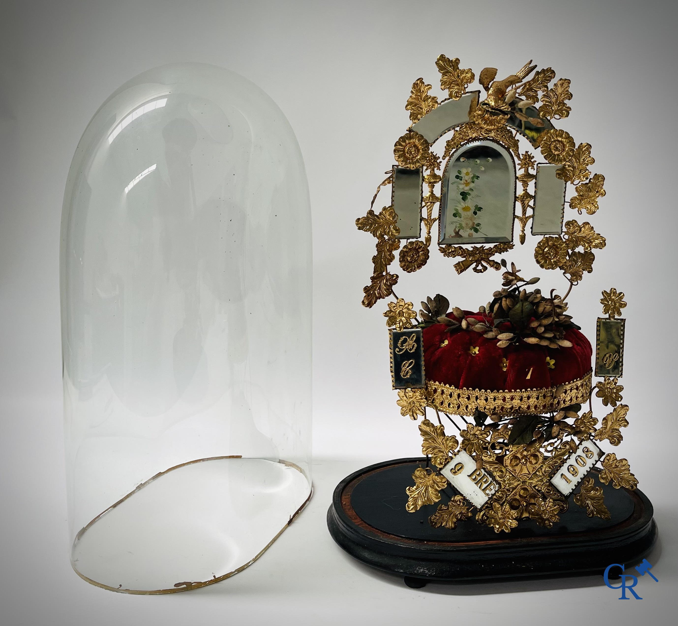 2 domes with wedding bouquet, one with flowers in biscuit, another with mirrors, dated 1908.