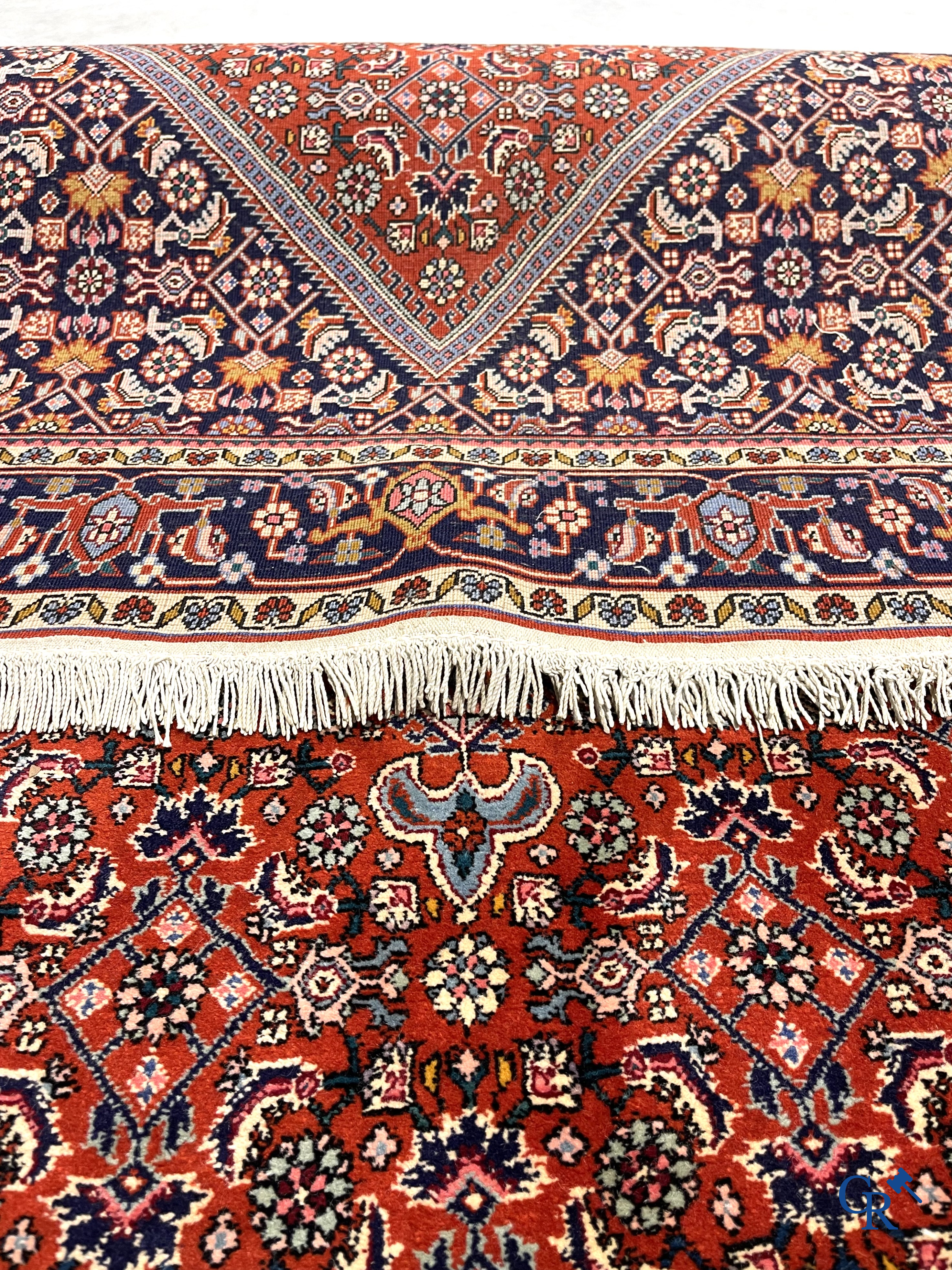 Oriental carpets. 2 hand-knotted rugs in wool.