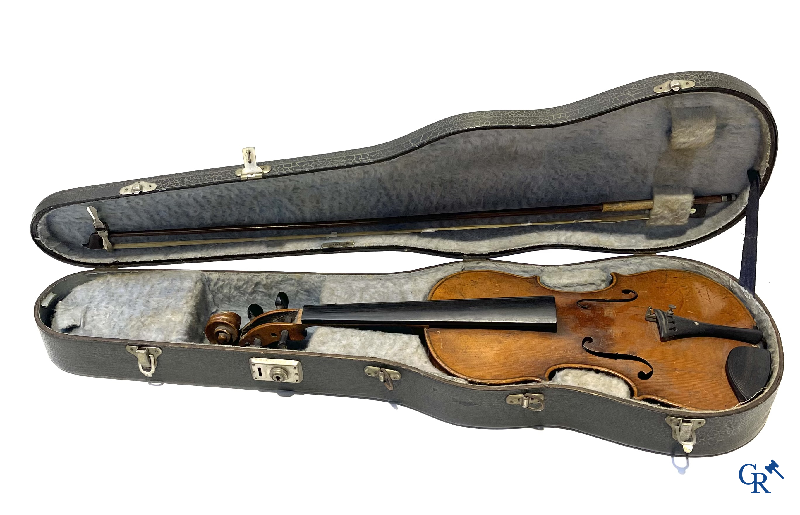 Antique violin with bow in storage case.