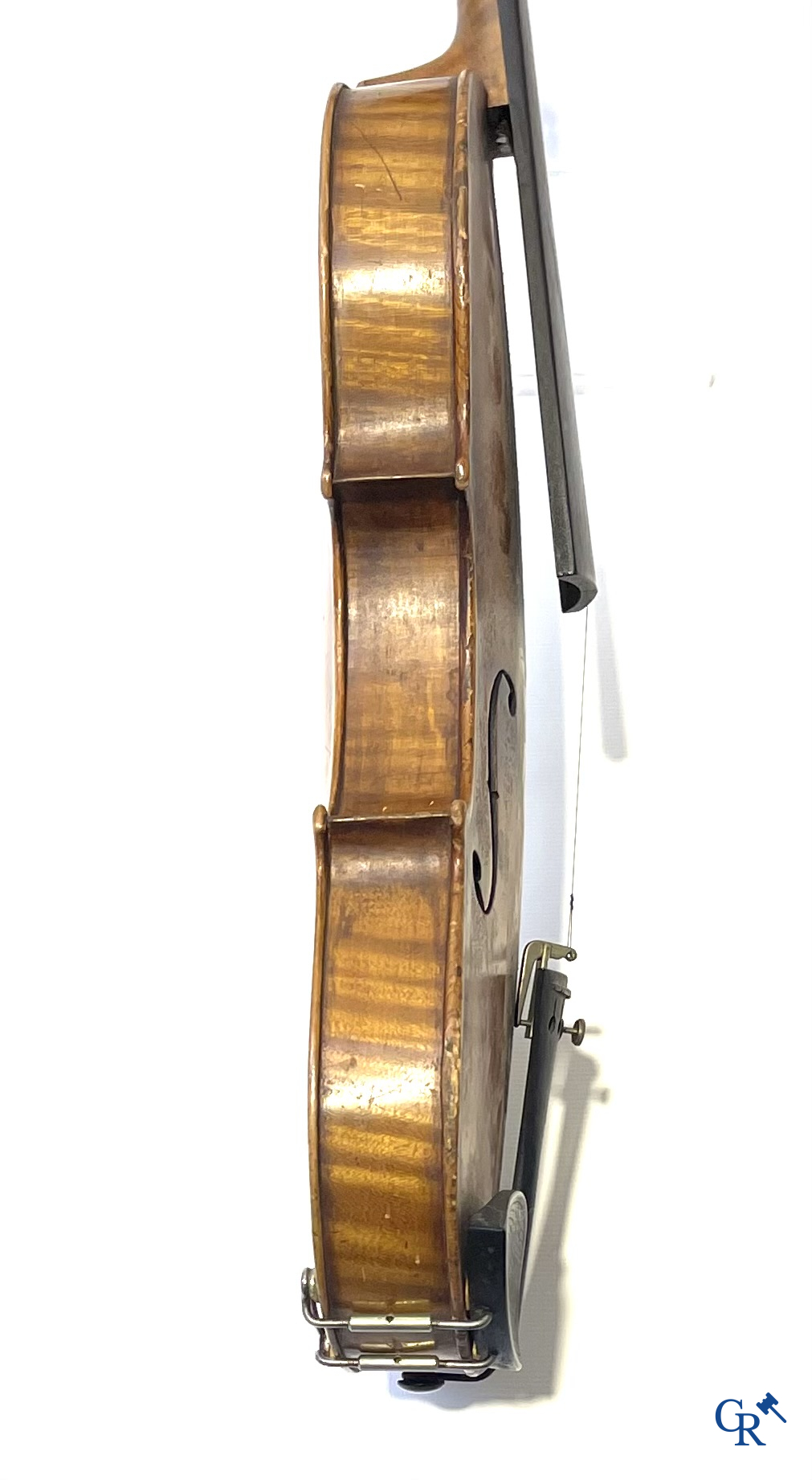 Antique violin with bow in storage case.