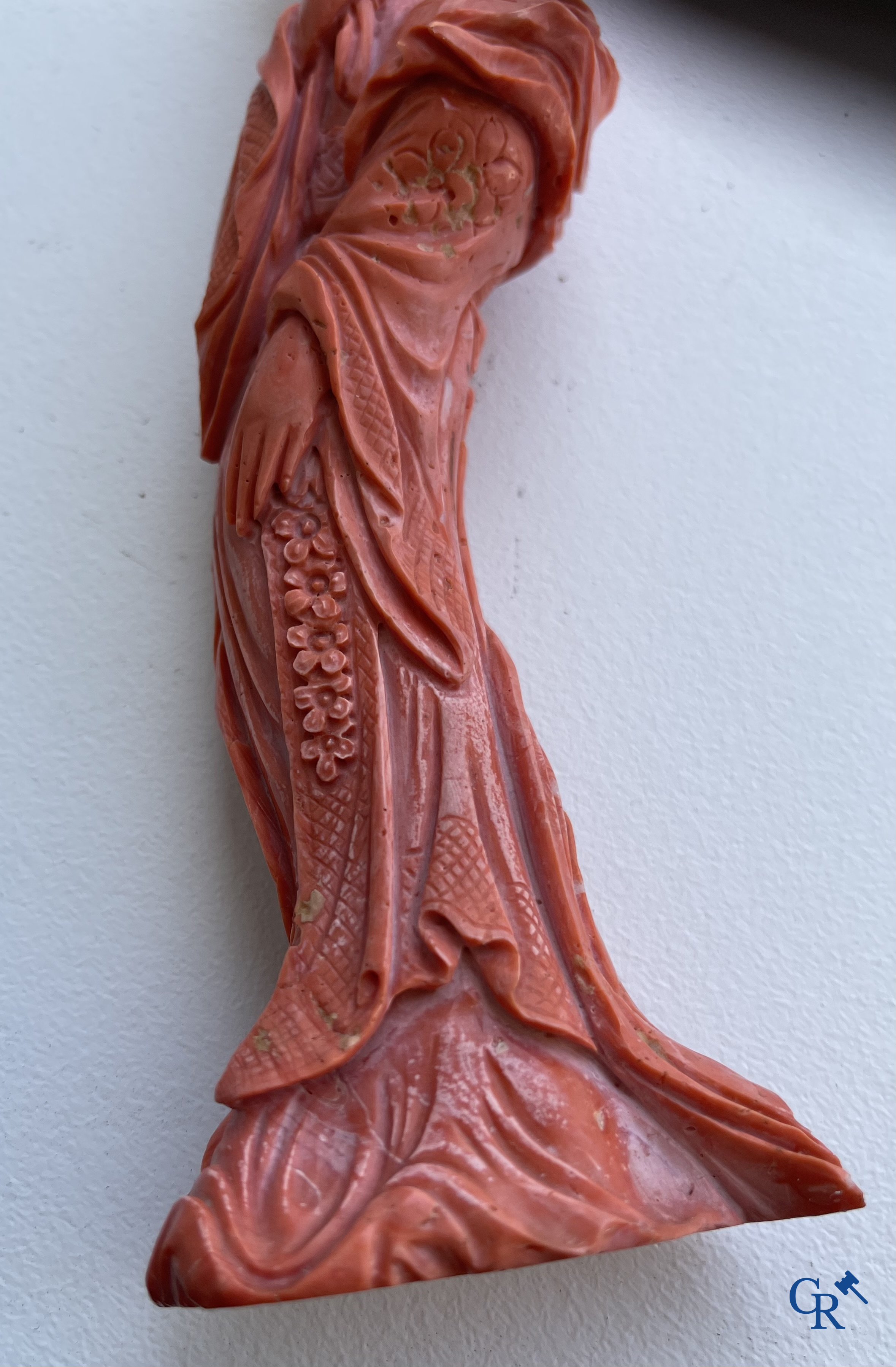 Asian Art, China. A red coral figure of a Chinese lady on a wooden pedestal.