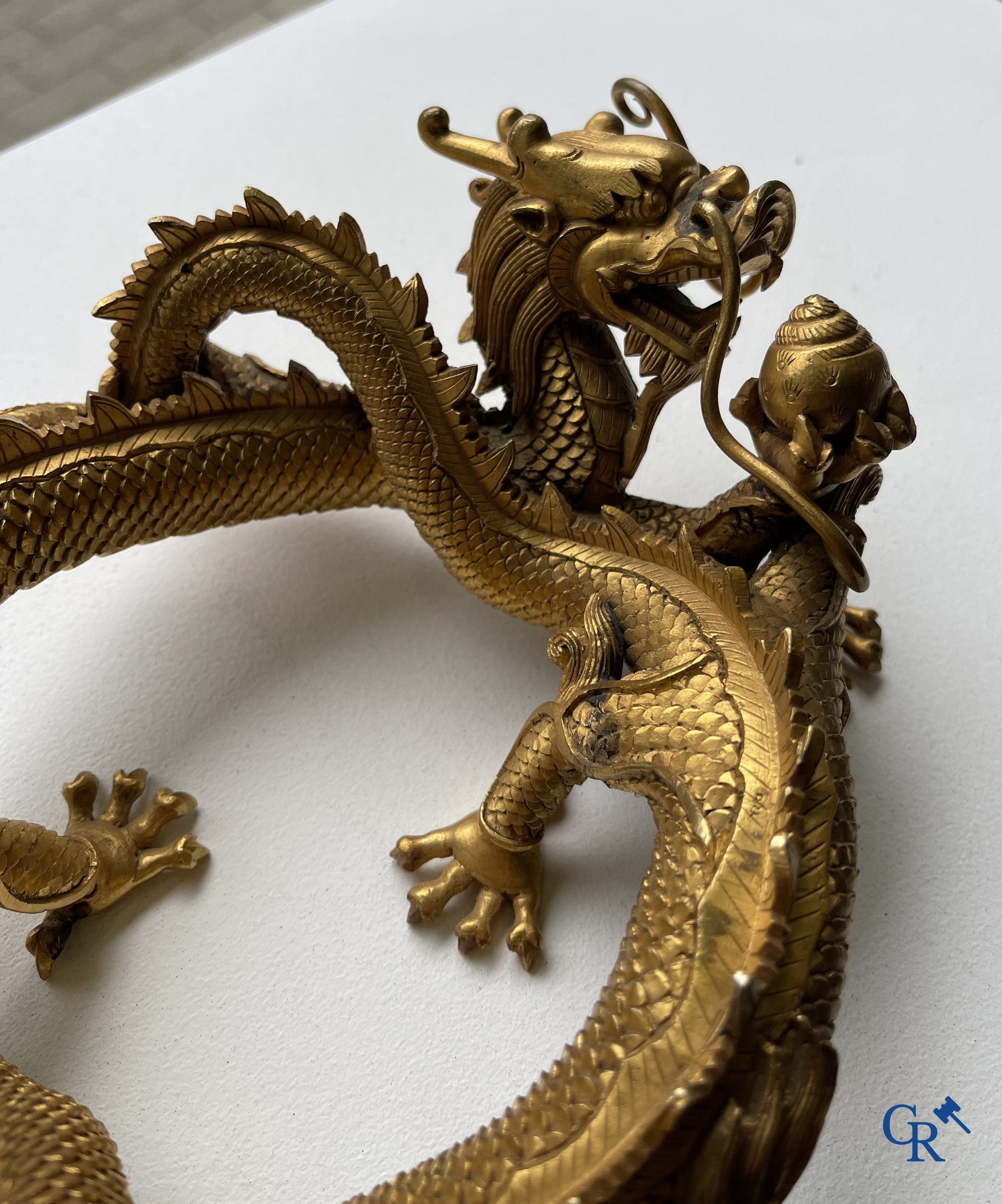 Asian Art. China. A rare Chinese gilt-bronze dragon stand. Qing Dynasty.