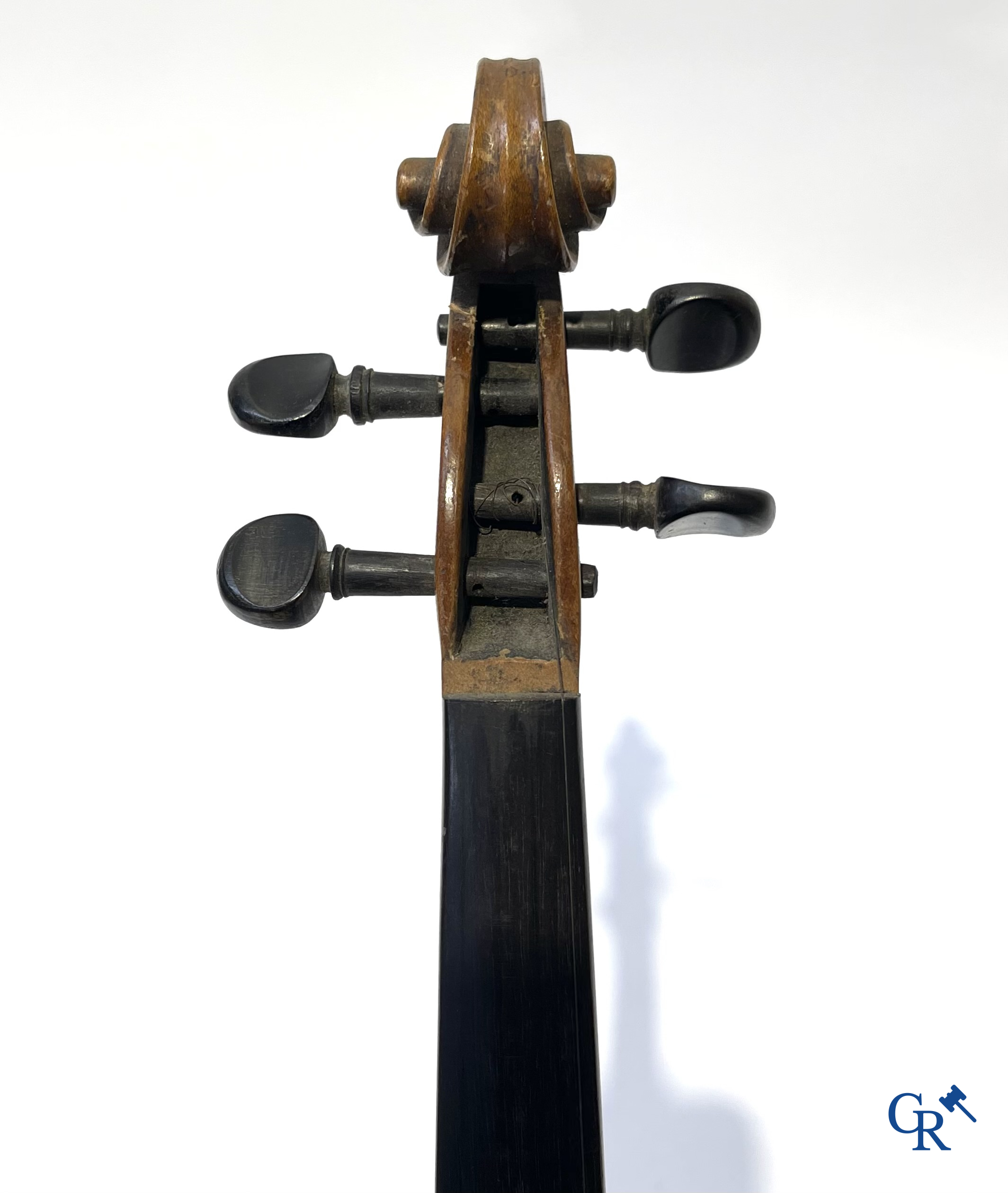 Antique violin with bow in storage case.