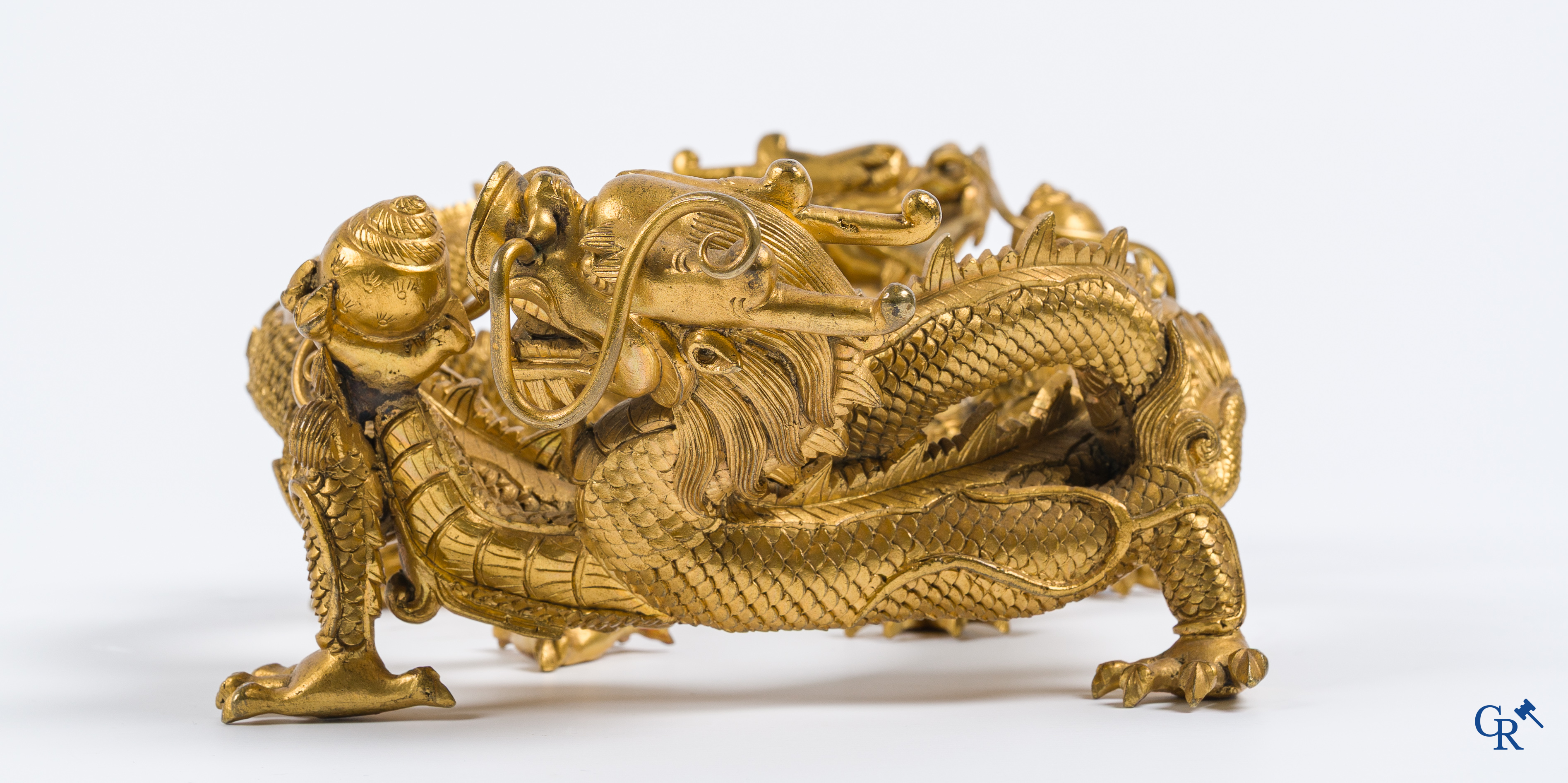 Asian Art. China. A rare Chinese gilt-bronze dragon stand. Qing Dynasty.