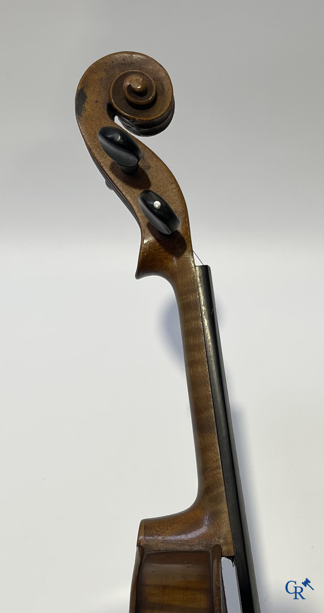 Antique violin with bow in storage case.