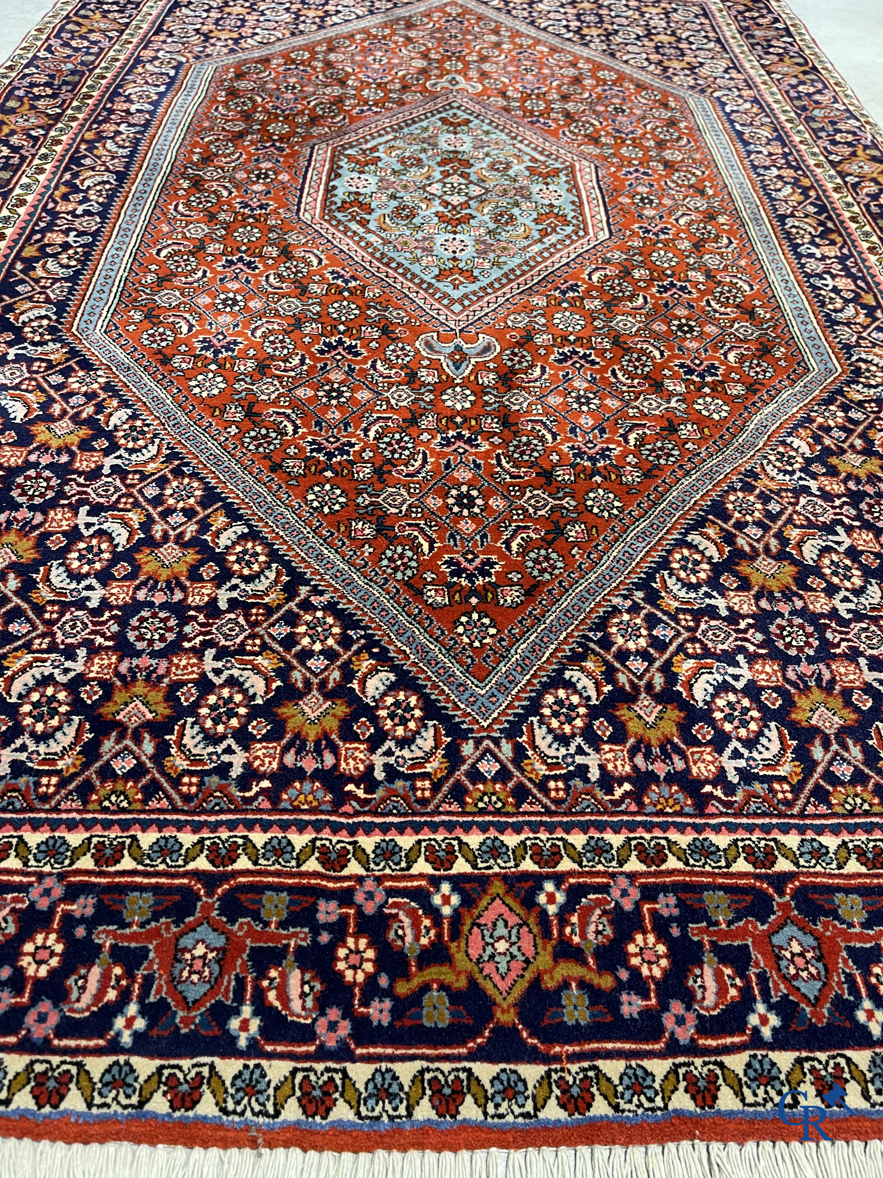 Oriental carpets. 2 hand-knotted rugs in wool.
