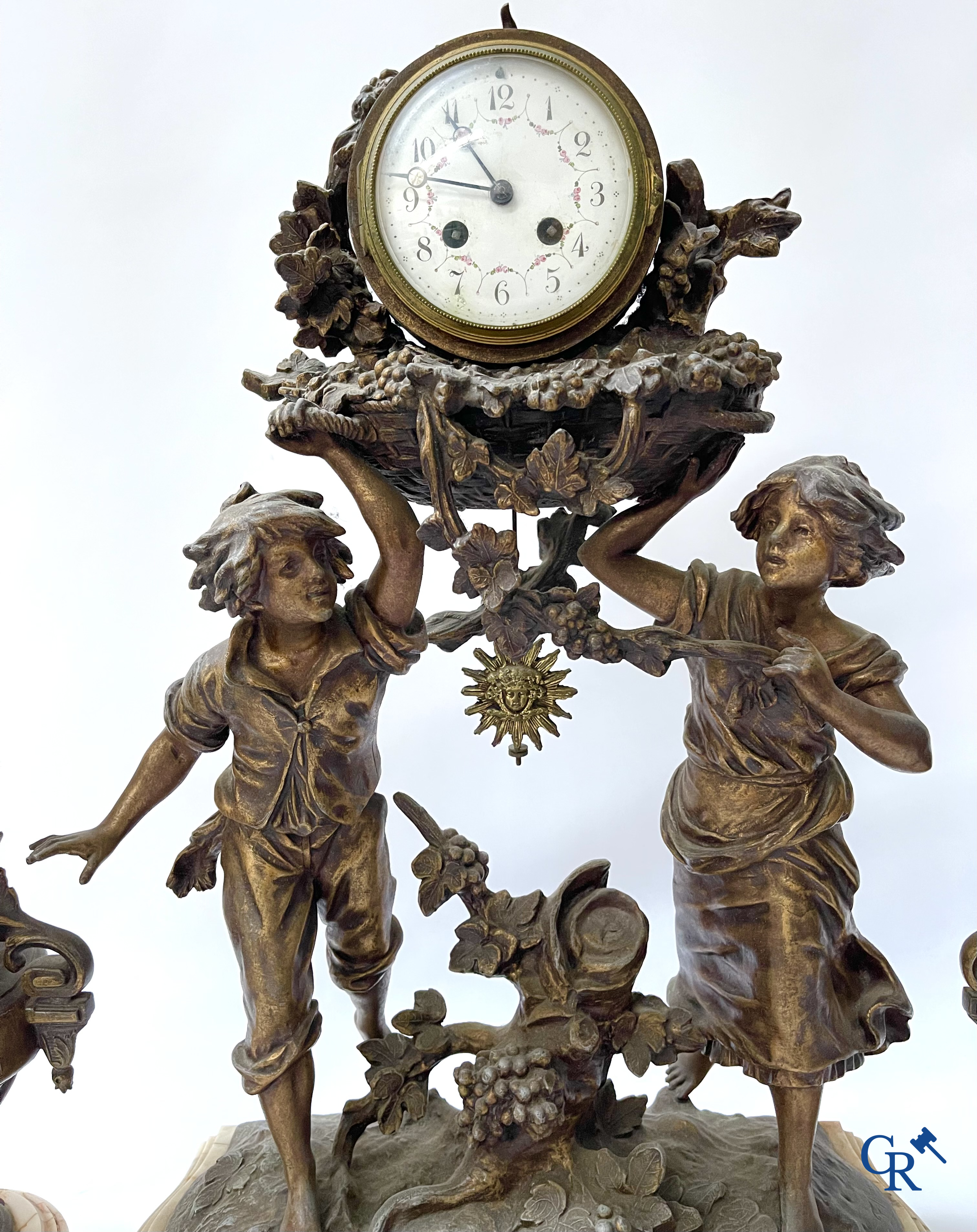 Louis & François Moreau (after). A large 3-piece fireplace set in spelter and marble. Circa 1910.