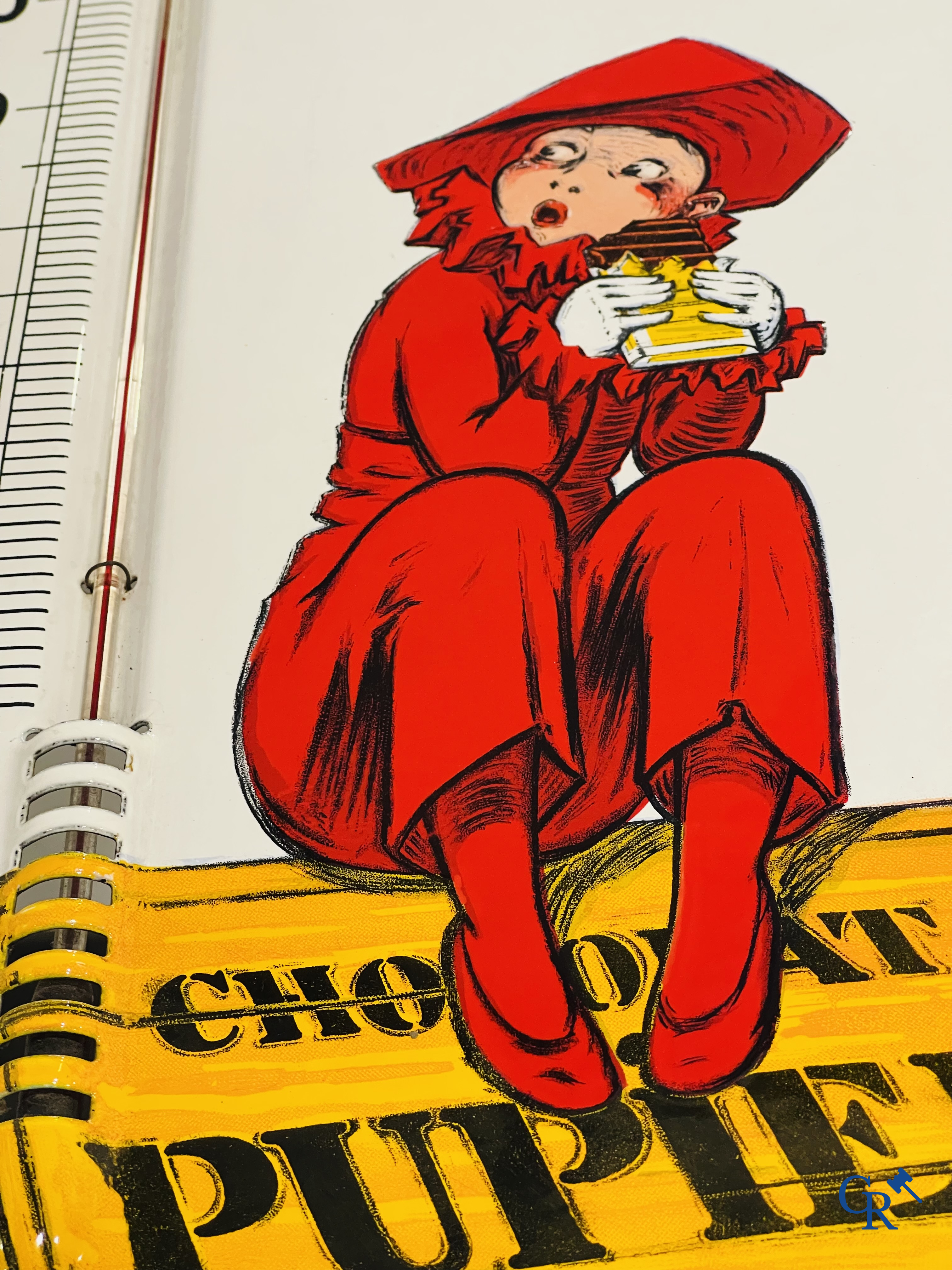 Chocolat Pupier, plaque émaillée illustré du personnage de Jean D'Ylen, vers 1930.