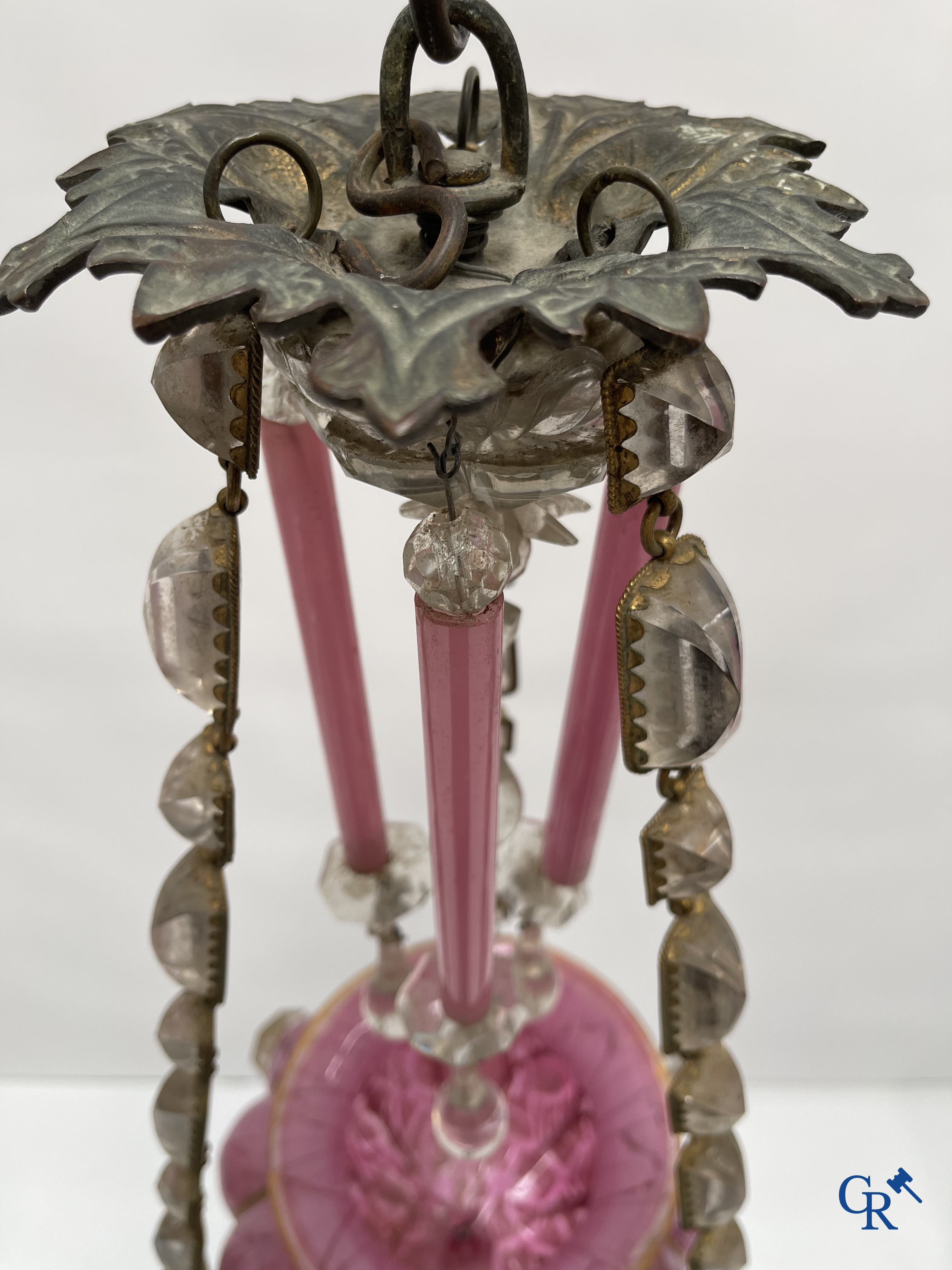 A chandelier in pink opaline and gilded frames with mounted crystal in the style of Baccarat. Circa 1860.
