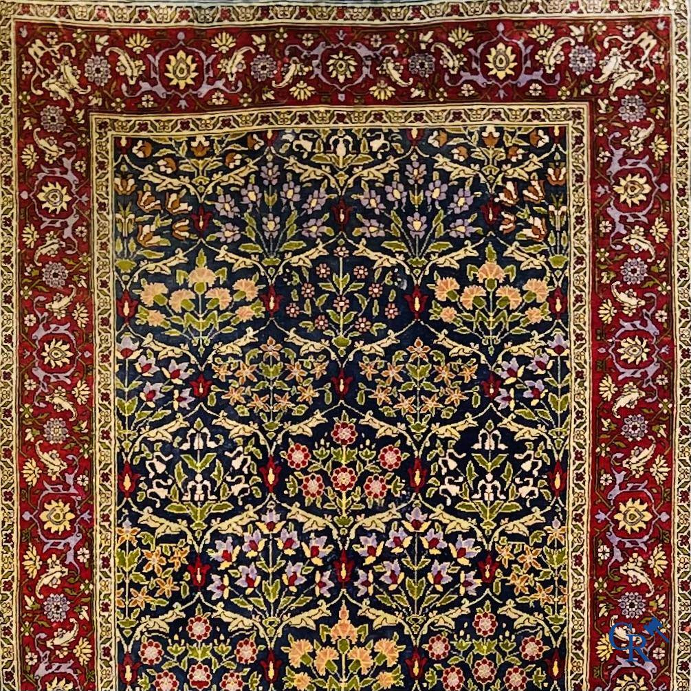 Oriental carpets, a finely hand-knotted silk carpet with floral decor.