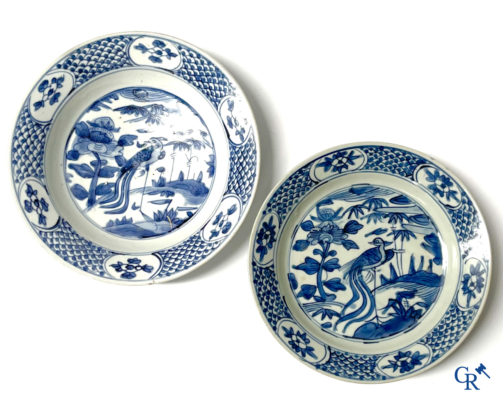Asian Art, A pair of large Swatow Chinese blue and white dishes decorated with a peacock. Ming Dynasty. Late XVI century.