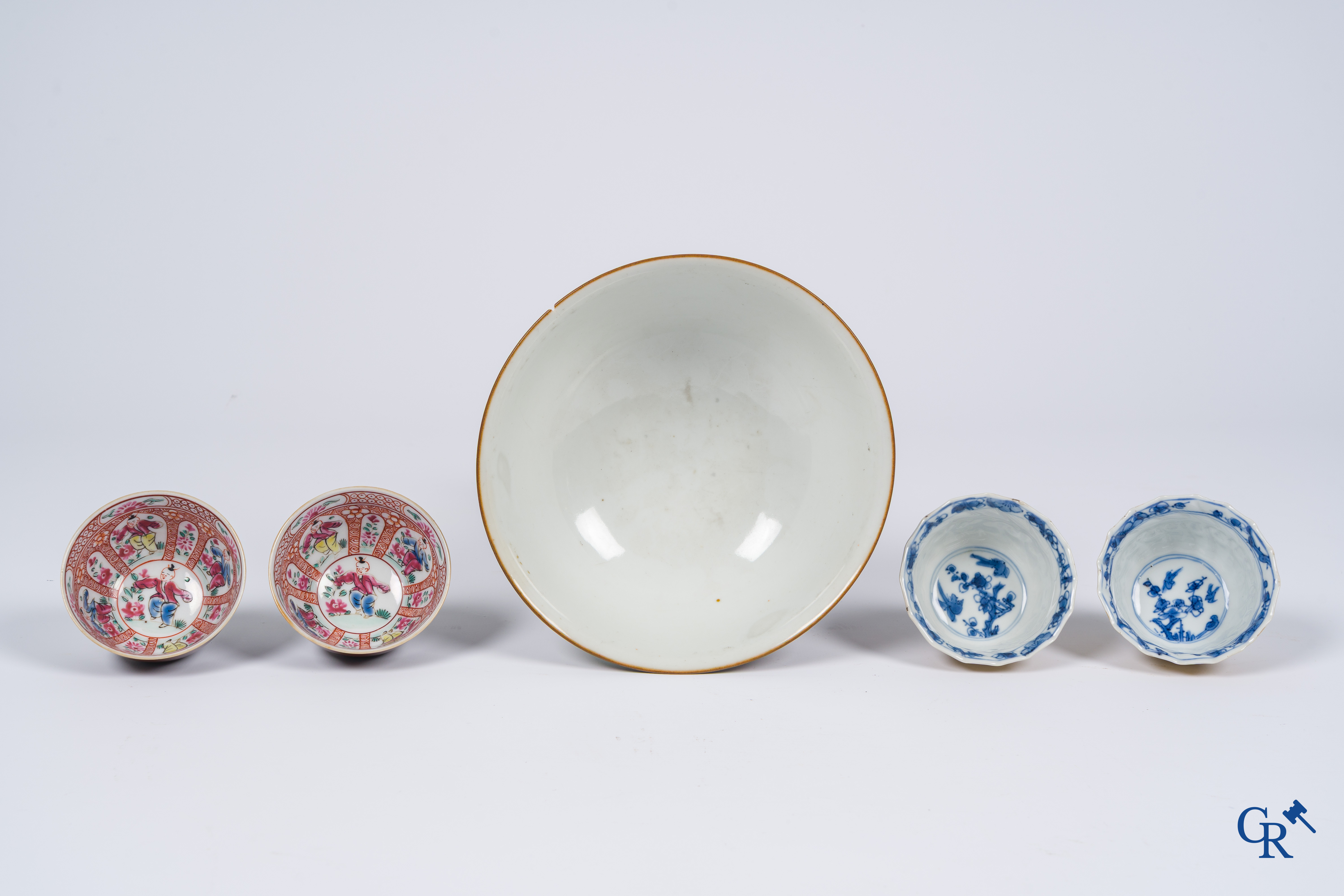 Asian Art, Chinese porcelain. A large Chinese "café au lait" bowl and saucer. 4 cups with saucers attached.
