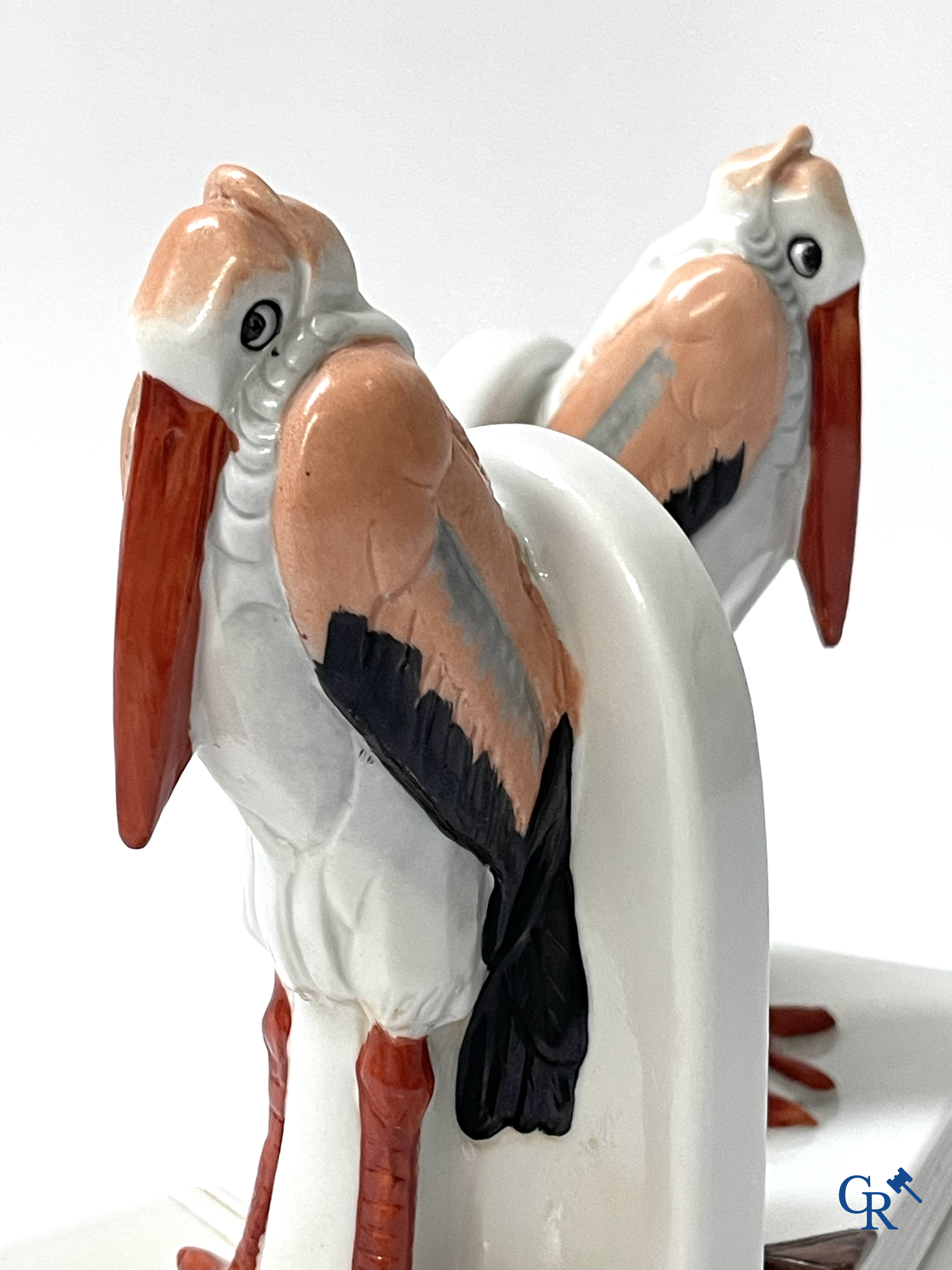 Art Deco, a pair of bookends in polychrome porcelain with a typical Art Deco representation of marabou.