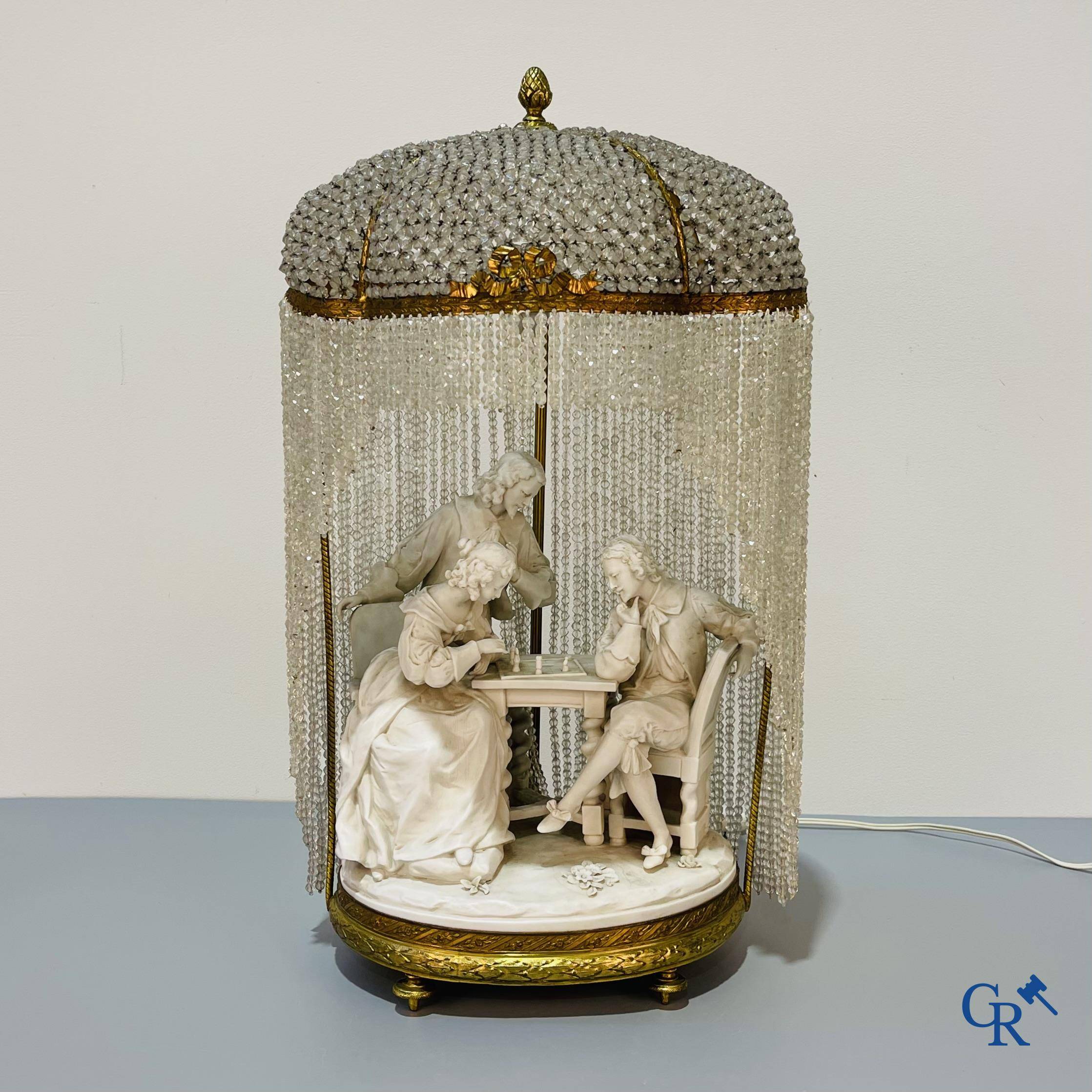 European porcelain, Karel Ens Volkstedt, a large lamp in biscuit and bronze, LXVI-style. Marked. Around 1920.