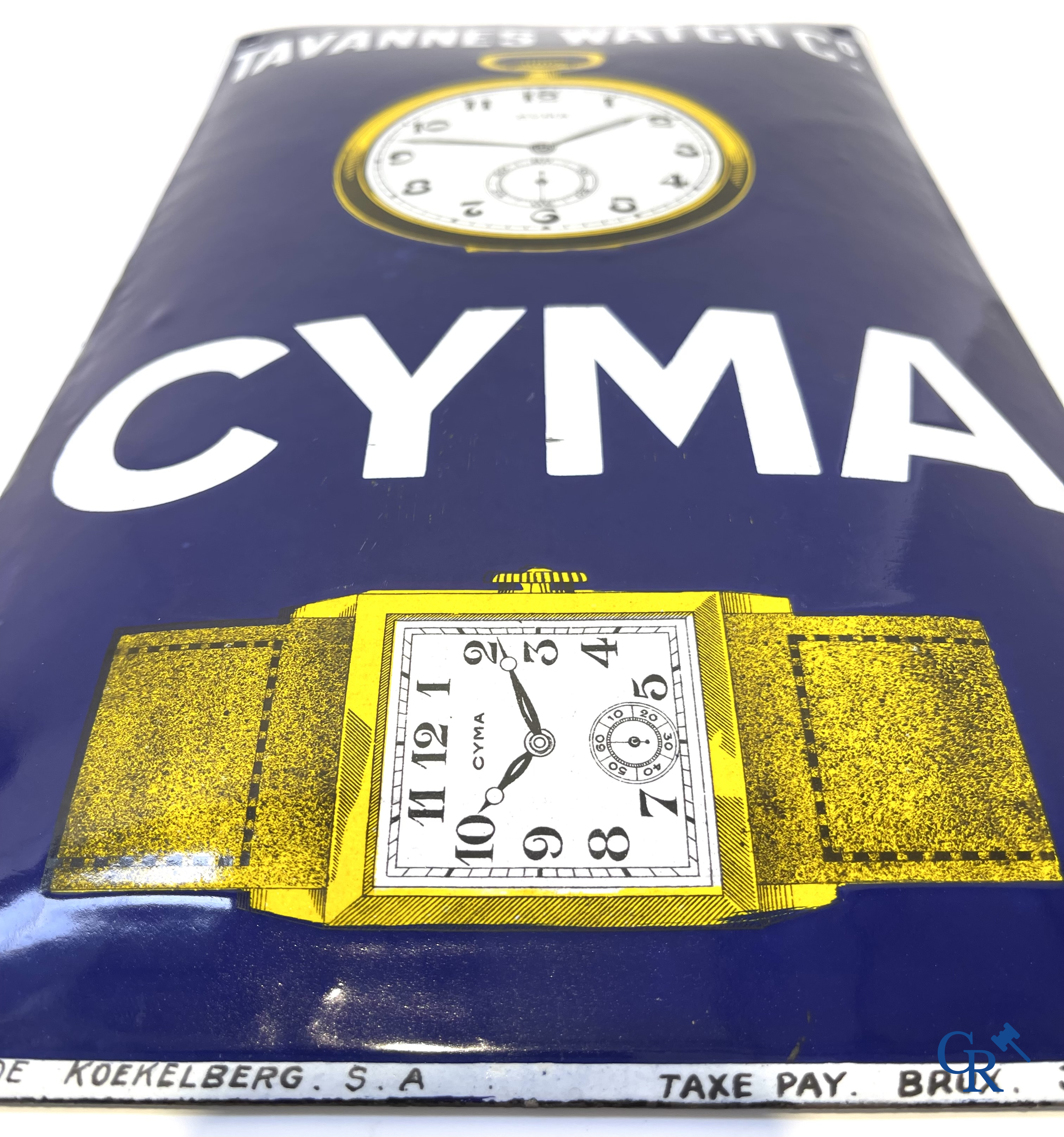 Tavannes Watch Company. Bombed enamel advertising sign for Cyma wrist and pocket watches. 1926.