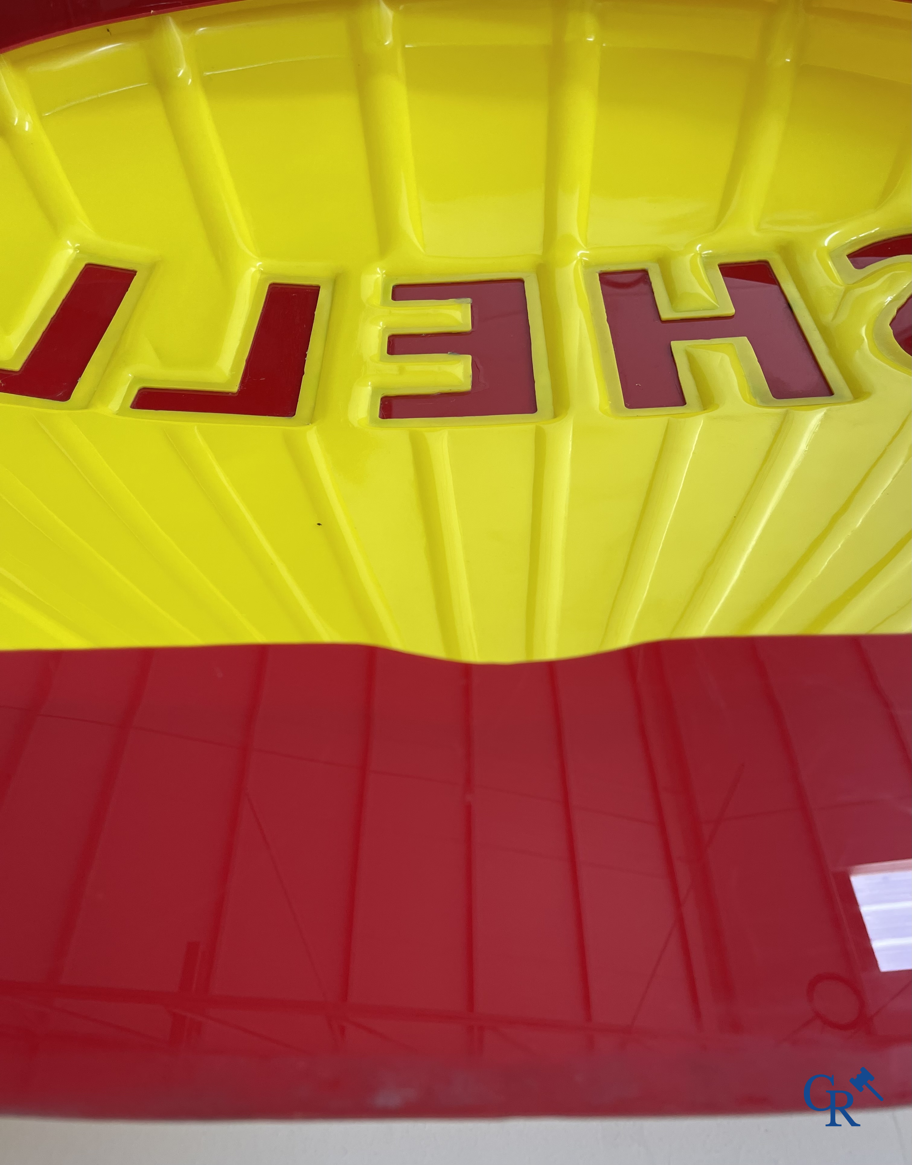 Shell, large representation of the red-yellow Shell shell in bombed plexiglass.