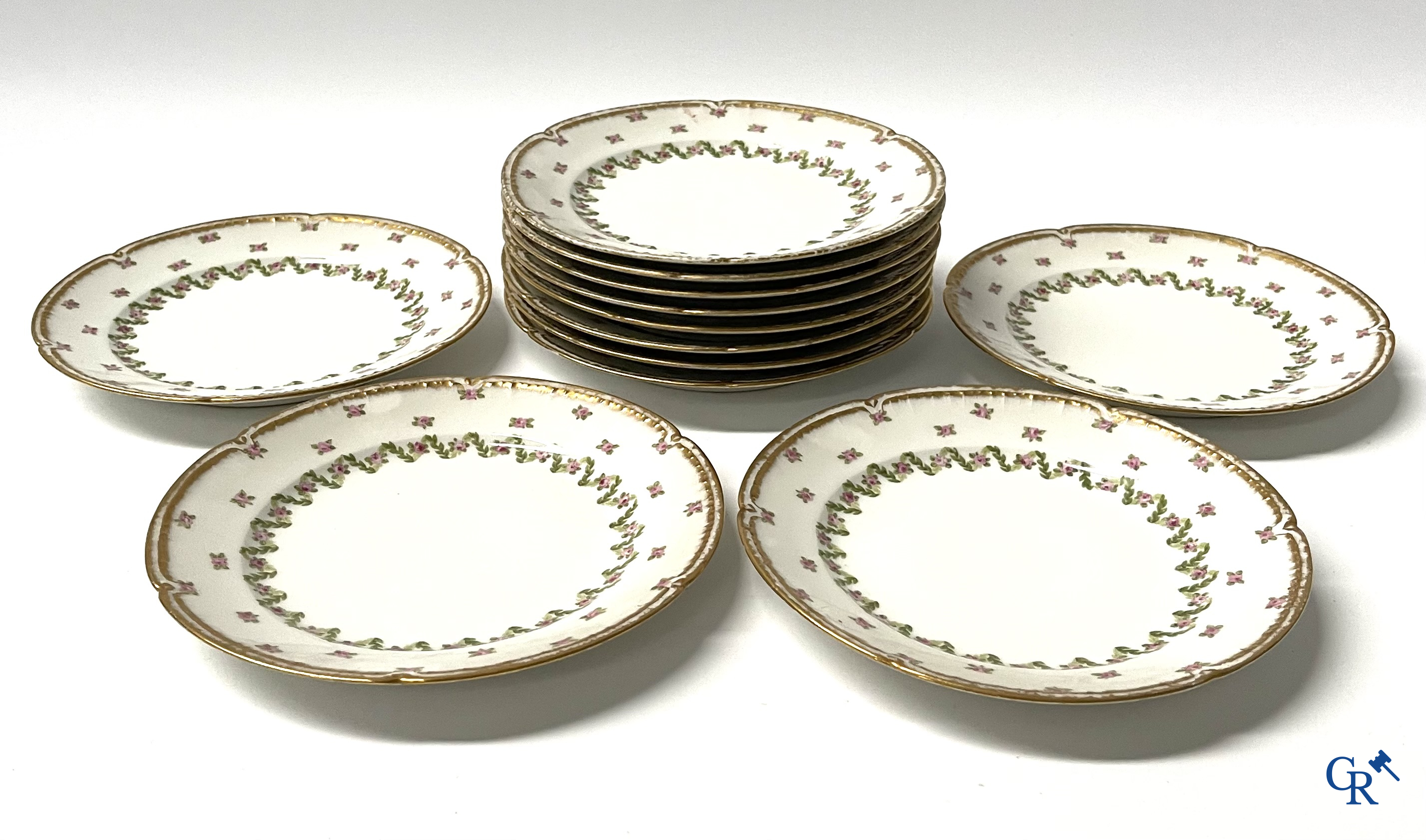 A coffee and tea set with 12 dessert plates in gilded and polychrome decorated French porcelain. Around 1900.