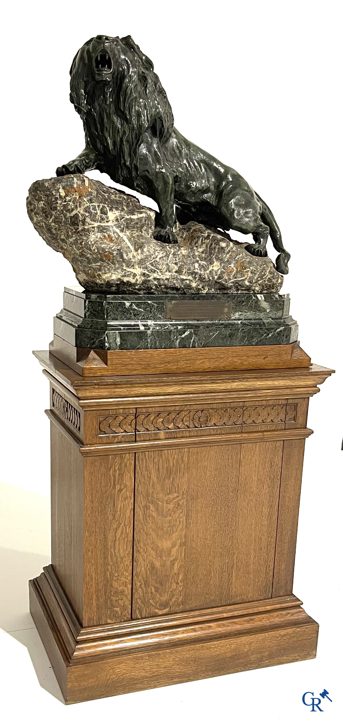 Thomas François Cartier (1879-1936) "Roaring lion" Important statue in bronze and stone on a wooden base.