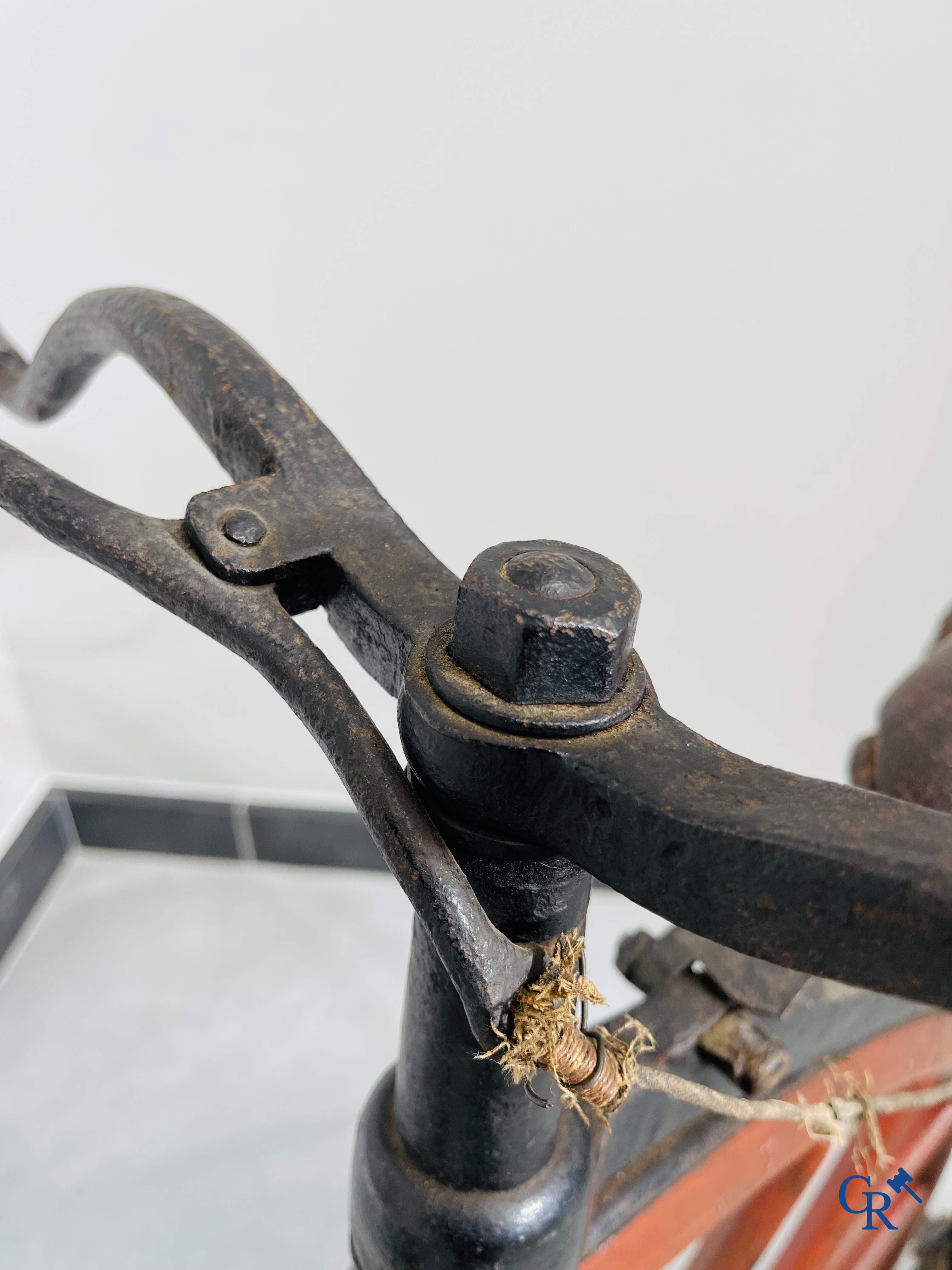 Penny-farthing with wooden spoked wheels on the original wrought iron upright. Circa 1880.