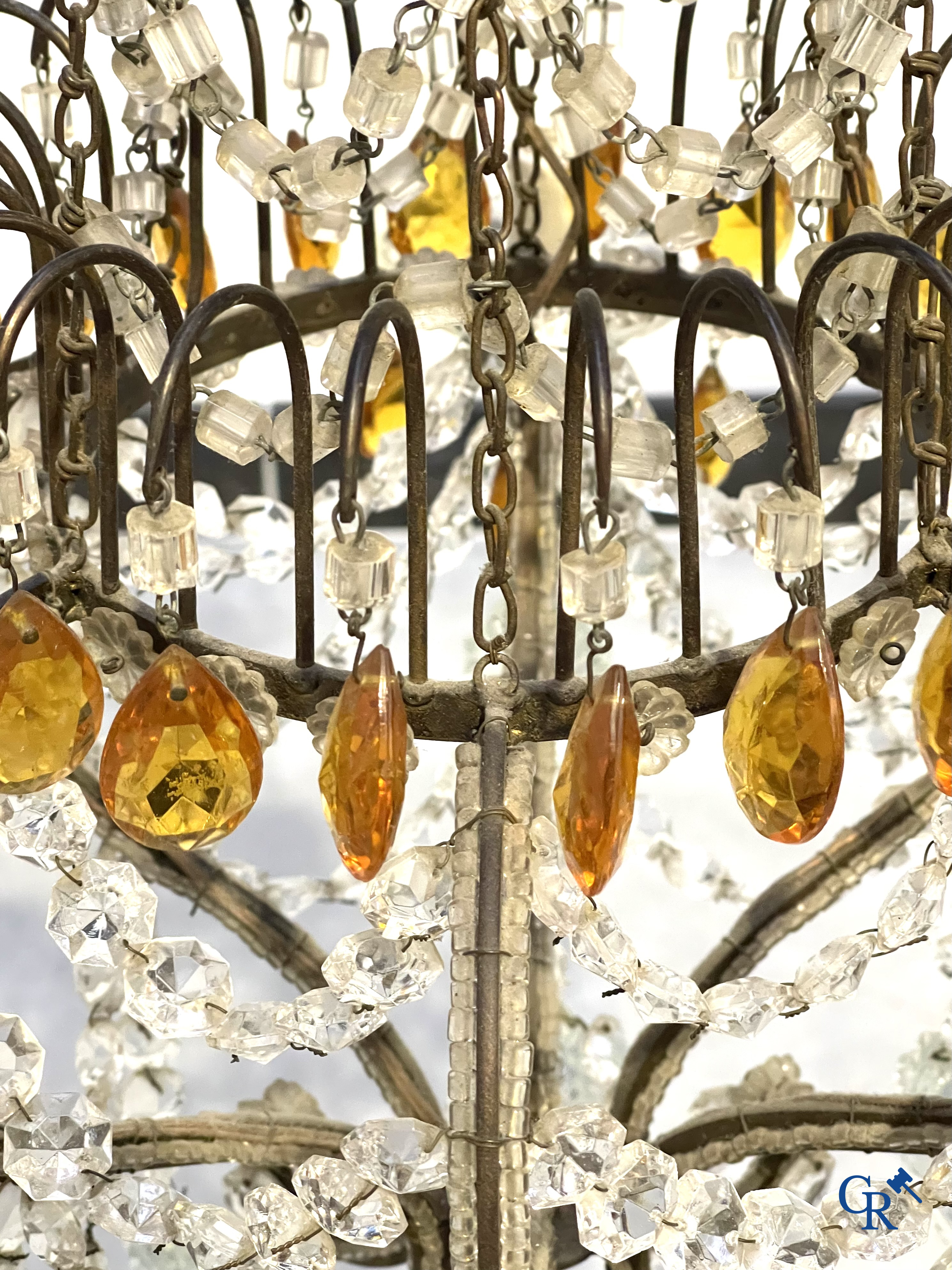 A large chandelier in crystal with double pearls on the frame.