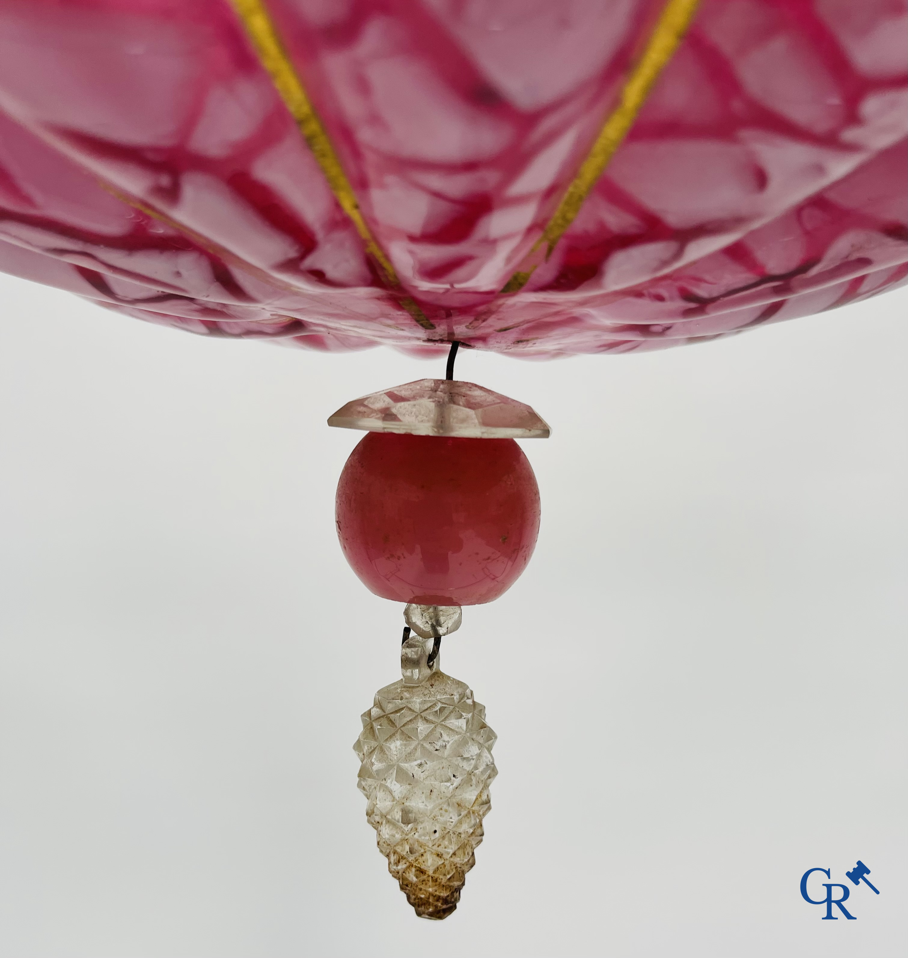 A chandelier in pink opaline and gilded frames with mounted crystal in the style of Baccarat. Circa 1860.
