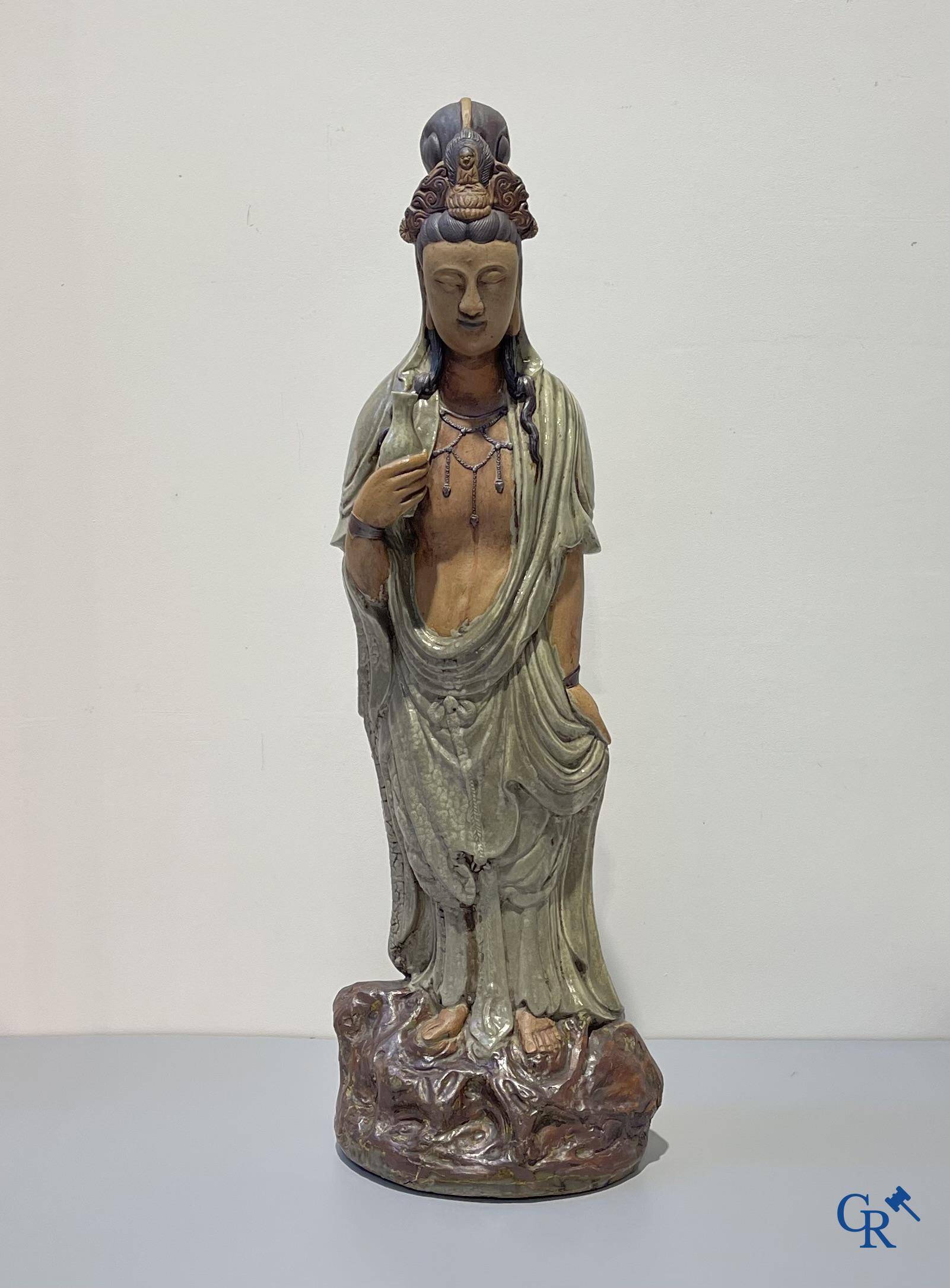 Asian Art, an imposing Shiwan earthenware figure of Guanyin.
