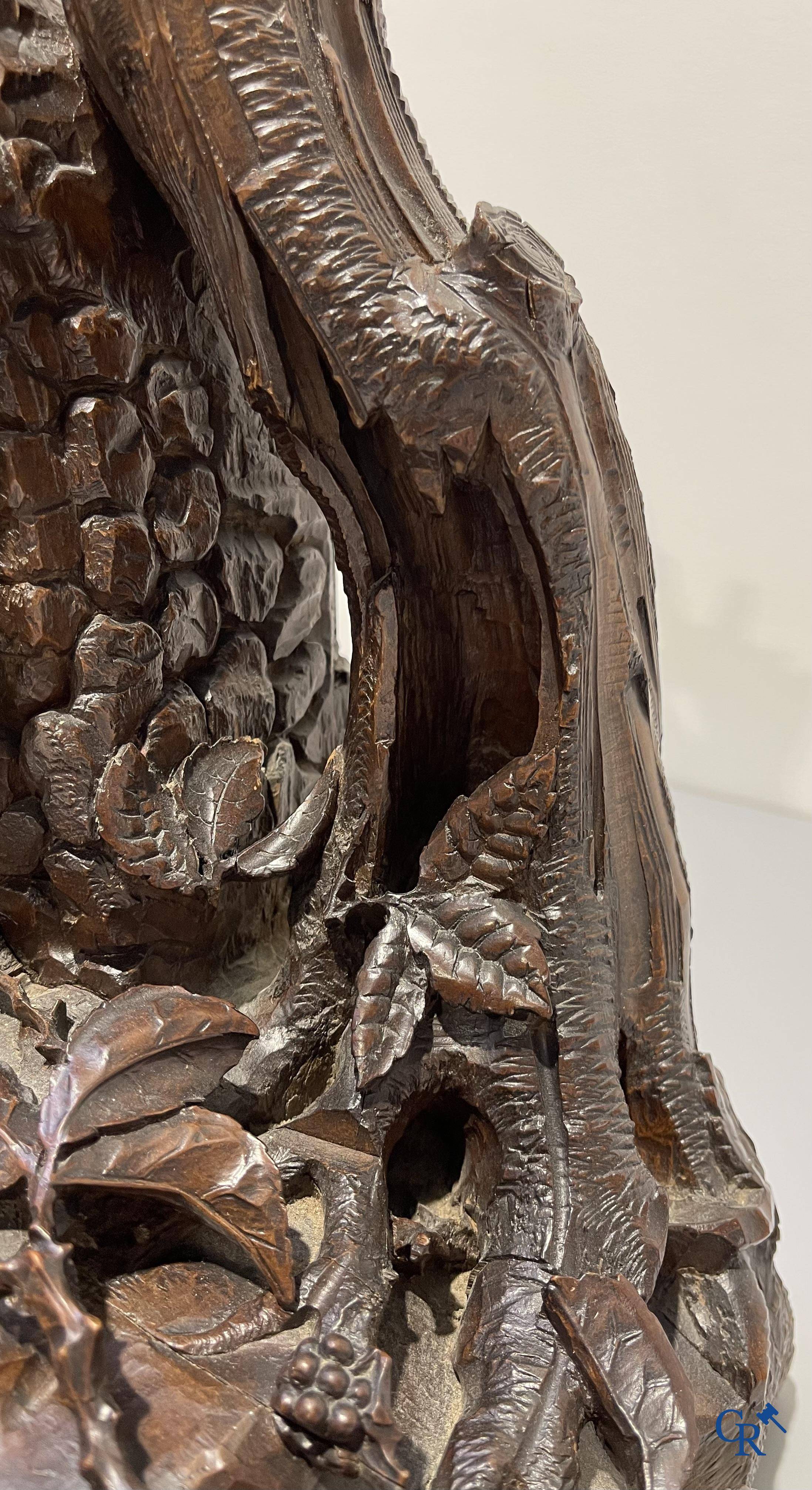 A finely carved walnut clock in so-called "black forest" carving. French work circa 1860-1880.