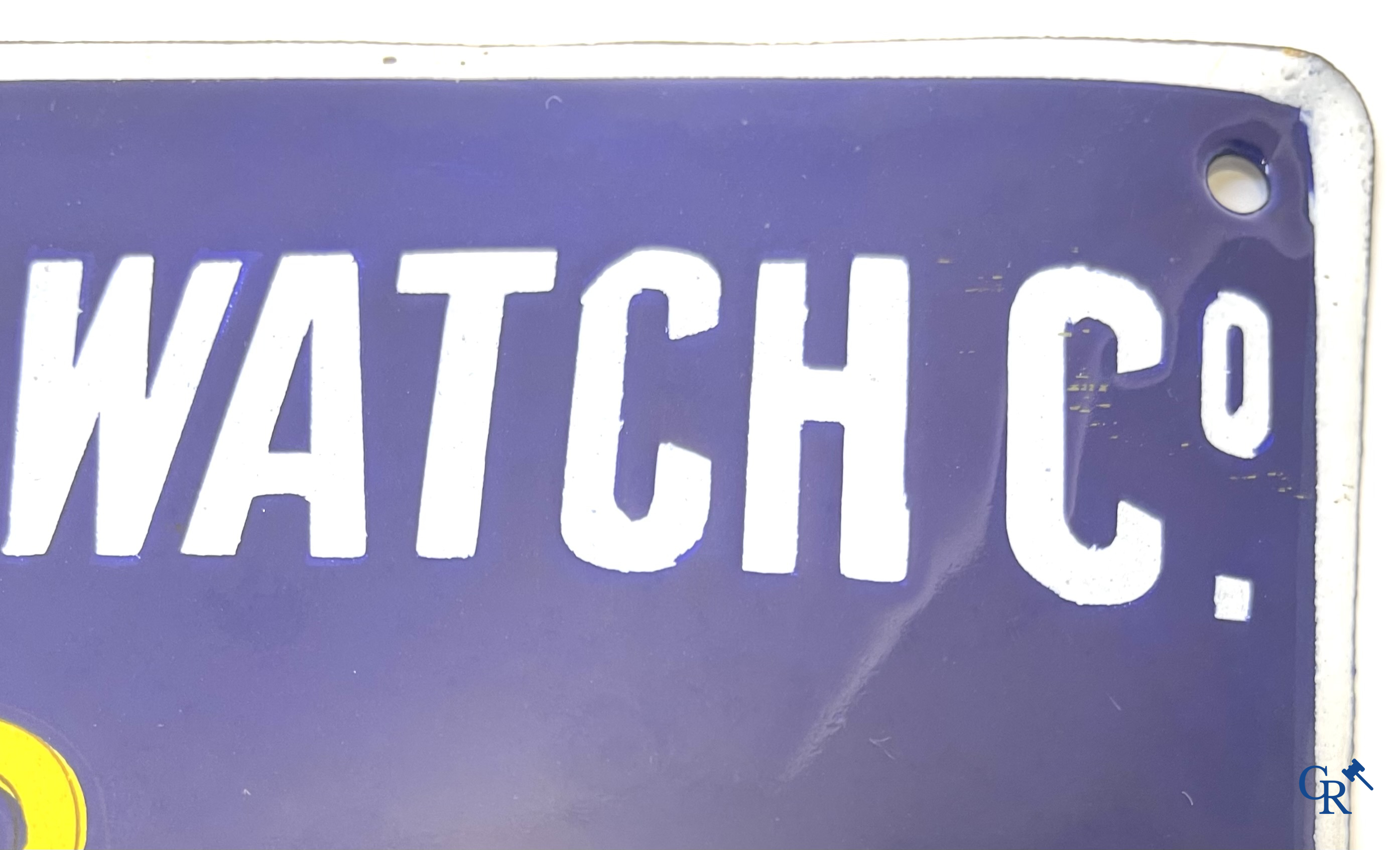 Tavannes Watch Company. Bombed enamel advertising sign for Cyma wrist and pocket watches. 1926.