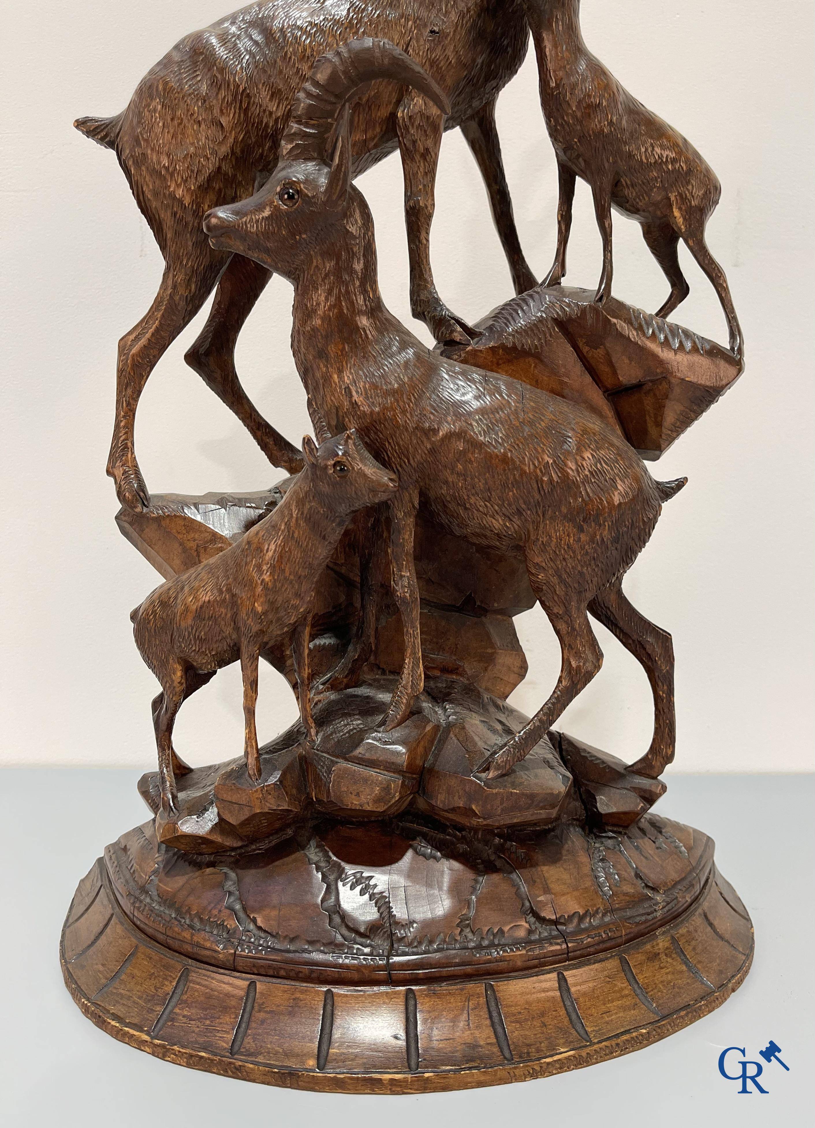 A Black Forest wood sculpture with capricorns, Germany circa 1900.