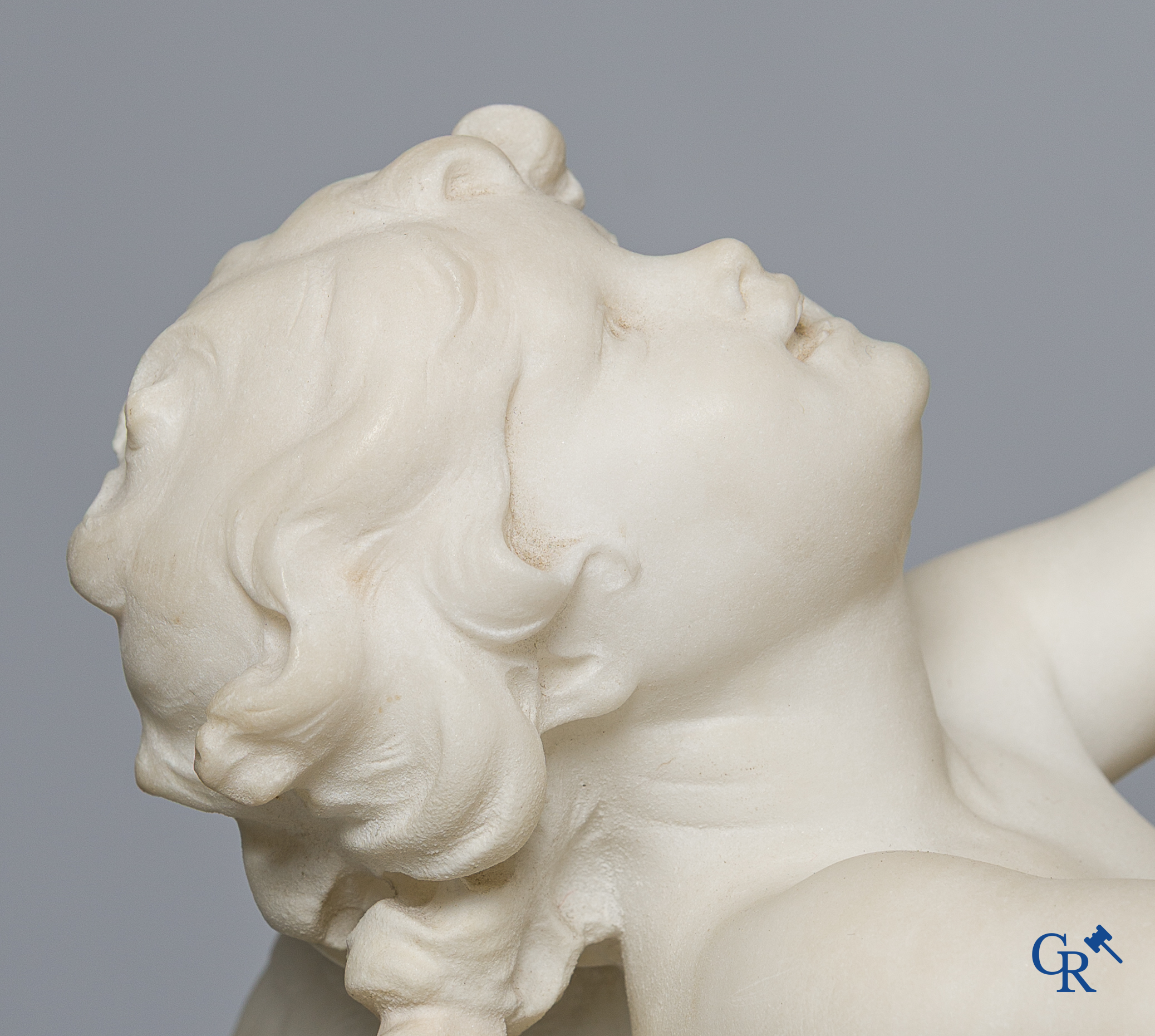 Cipriani. Romantic representation in sculpted marble. Young lady with cupid. LXVI style pedestal. Circa 1900.