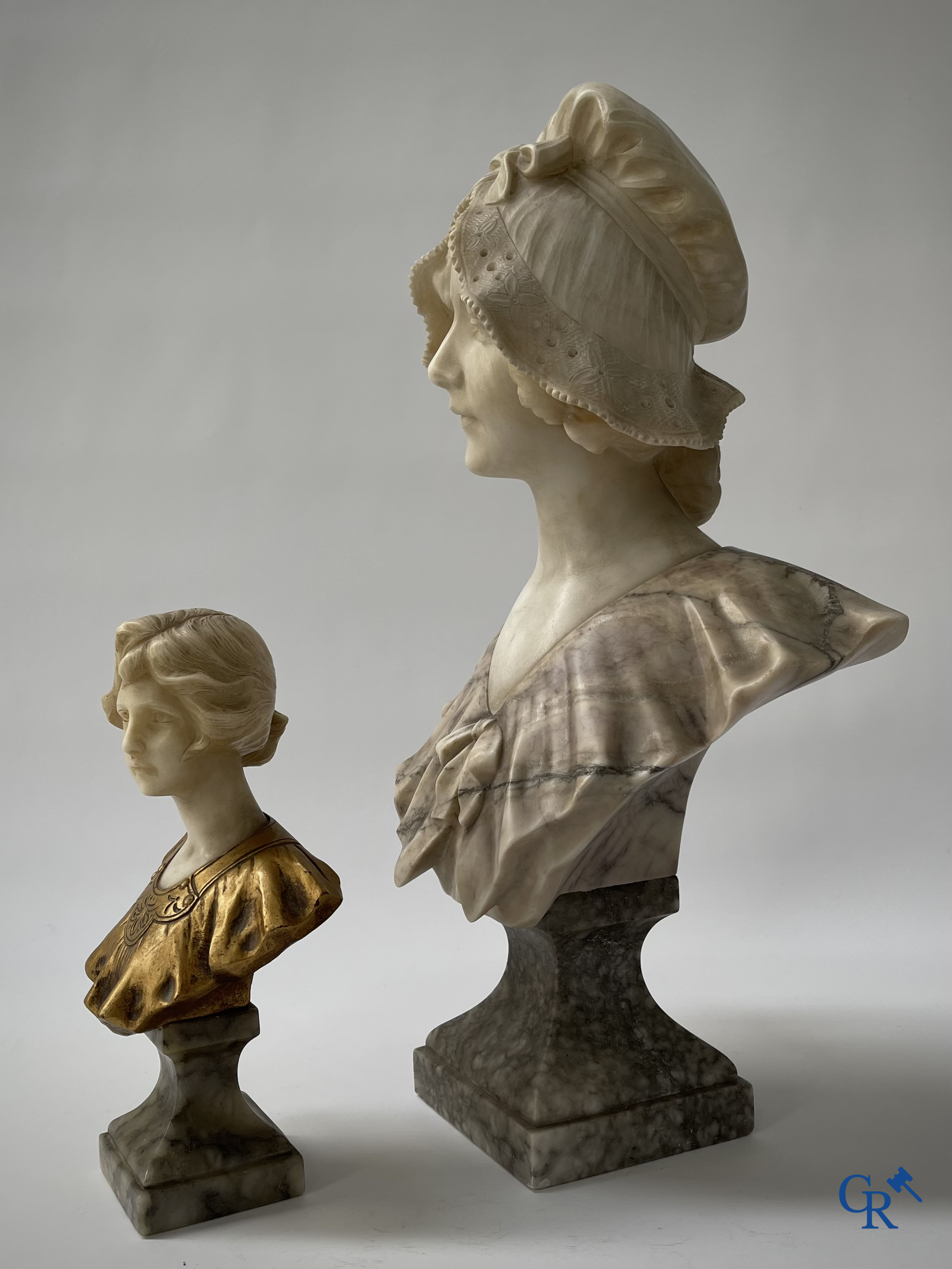 G. Van Vaerenbergh. A large bust in marble signed Van Vaerenbergh and a bust in marble and bronze. Around 1920.