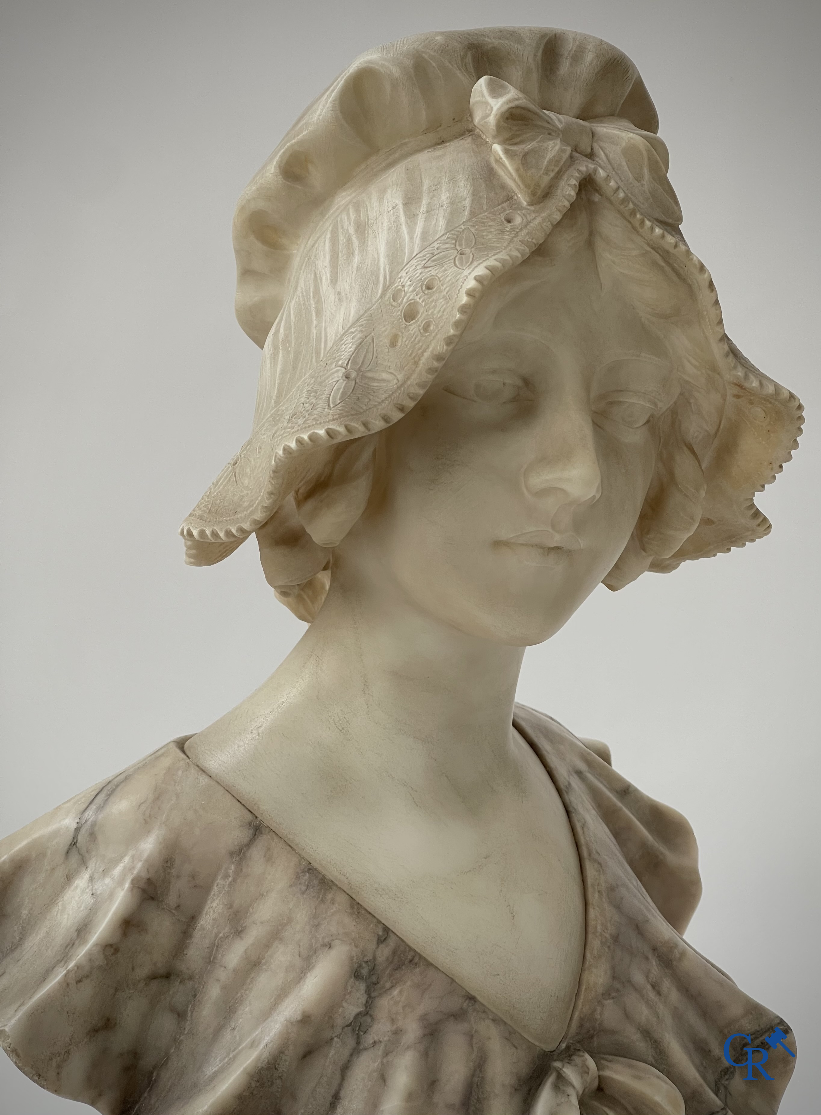 G. Van Vaerenbergh. A large bust in marble signed Van Vaerenbergh and a bust in marble and bronze. Around 1920.